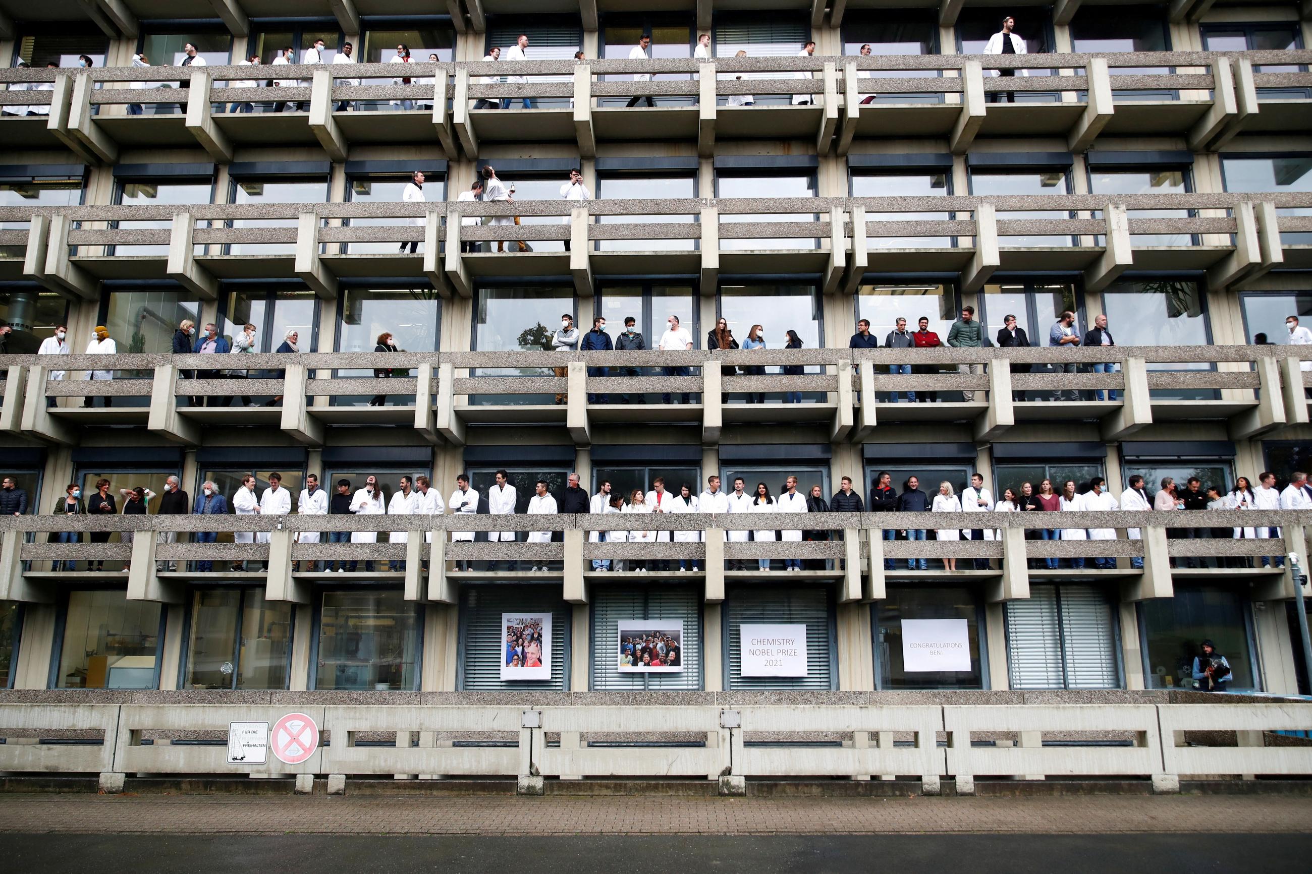 People wait for scientist Benjamin List, co-winner of the 2021 Nobel Prize in Chemistry, to arrive at the Max-Planck-Institute for Coal Research, in Muelheim an der Ruhr, Germany, on October 6, 2021.