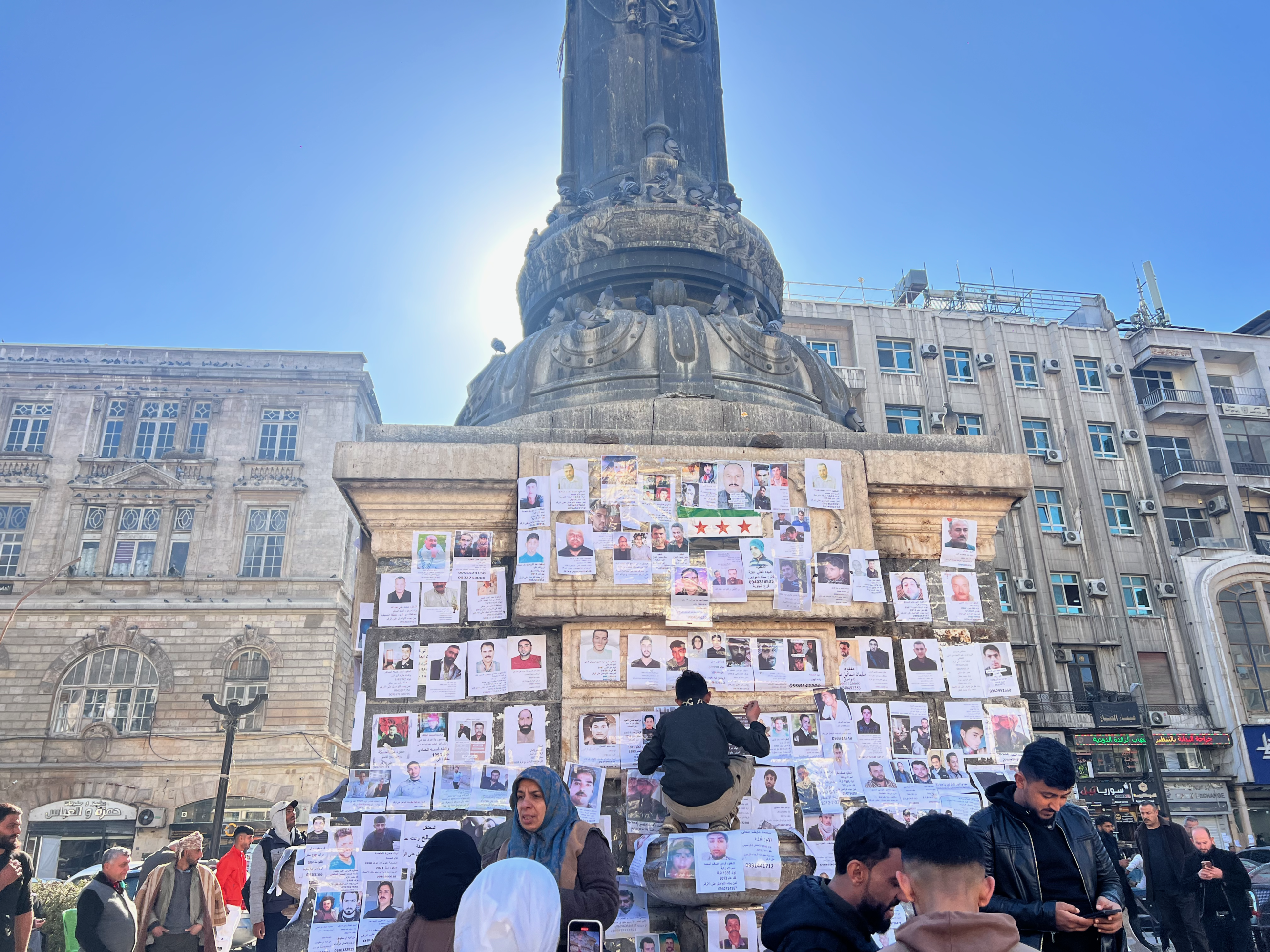 Families of Syria's disappeared and imprisoned gather in Martyr's Square in central Damascus to post notices and hear news of loved ones, in Damascus, Syria on December 2024.