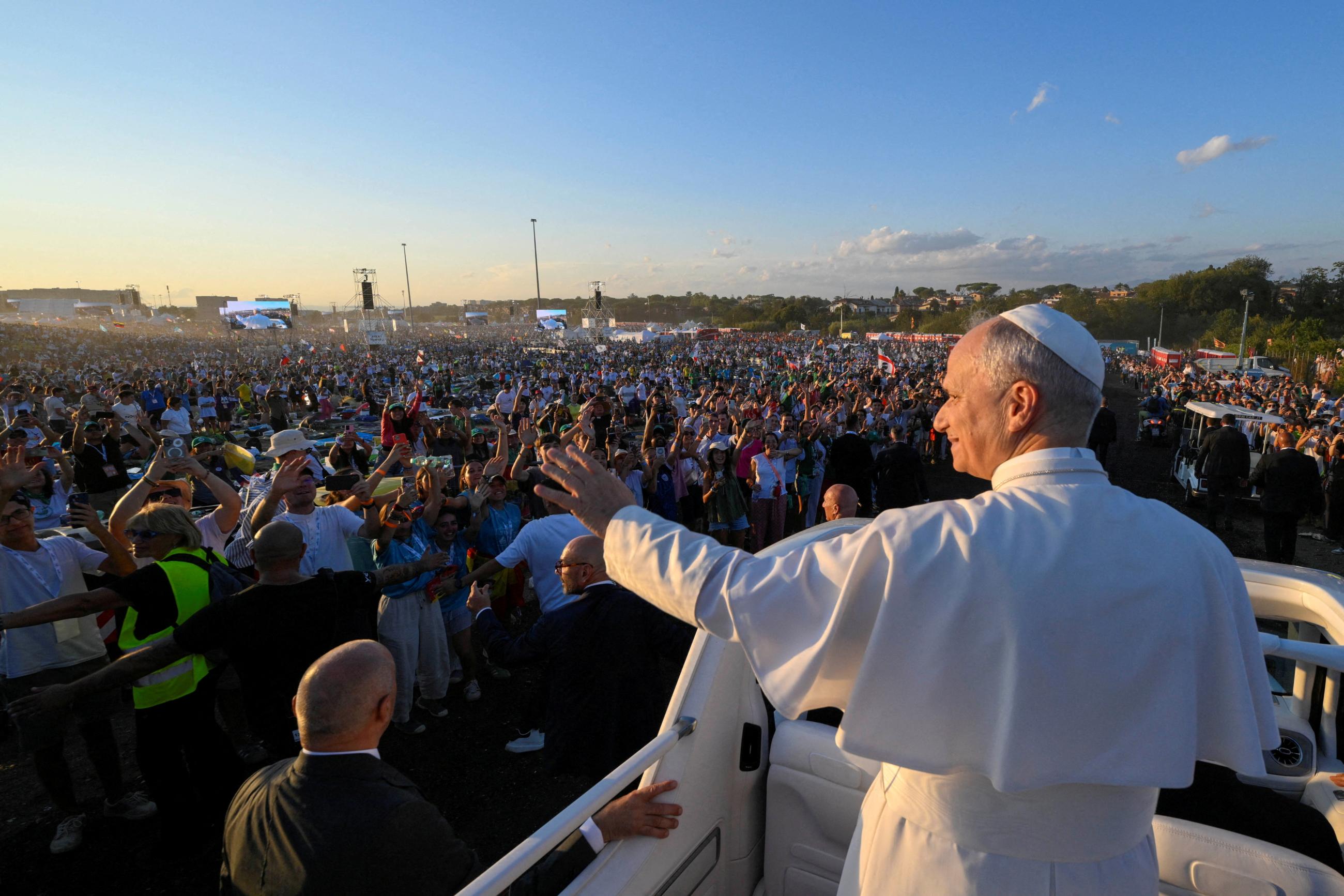 Pope Leo XIV waves from the popemobile as he attends a vigil for the Jubilee of Youth in Tor Vergata, in Rome, Italy, on August 2, 2025.
