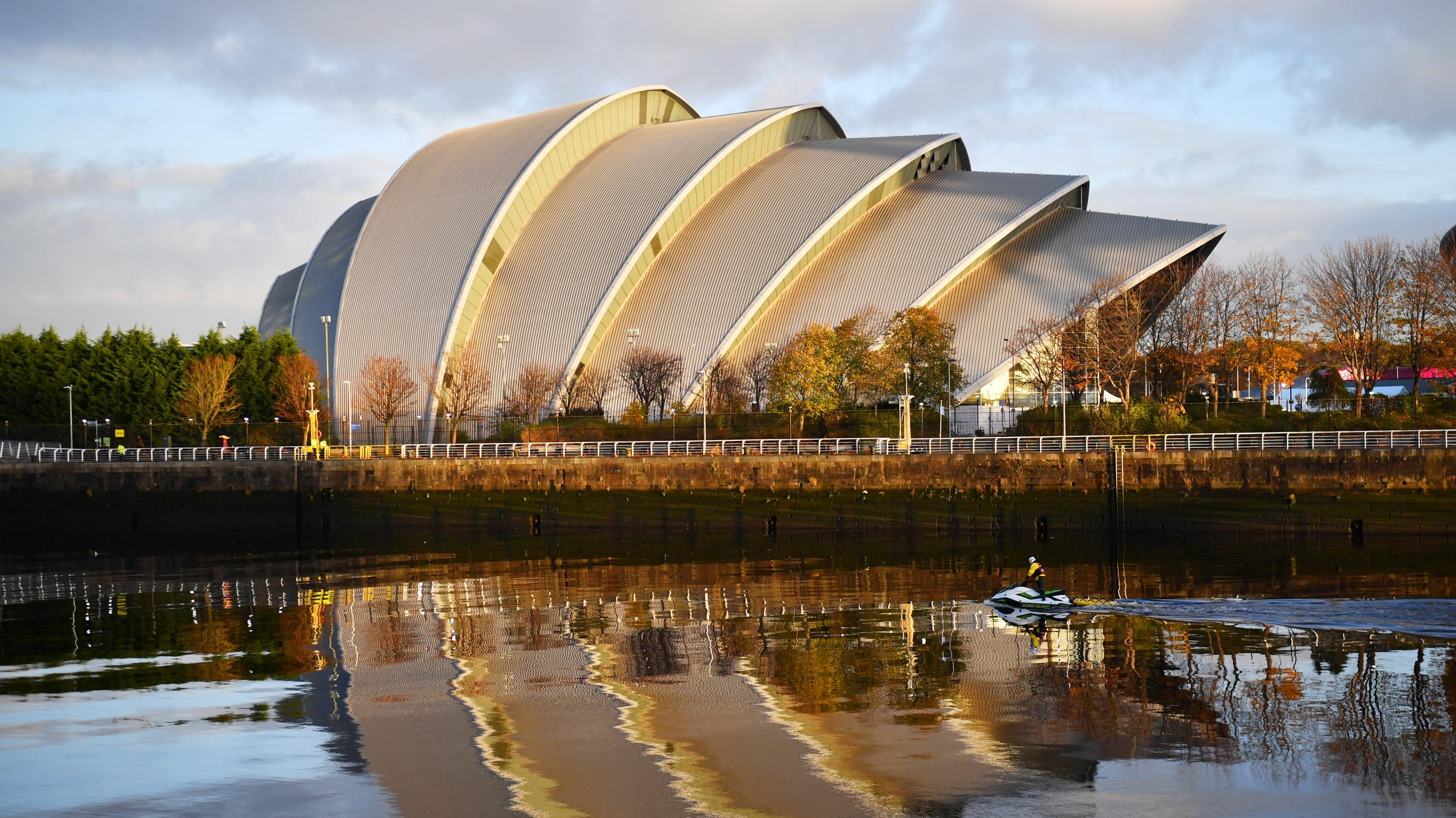 The coast guard patrol as the early morning sun shines on the River Clyde and the venue for COP26 in Glasgow, Scotland, on 10, 2021.