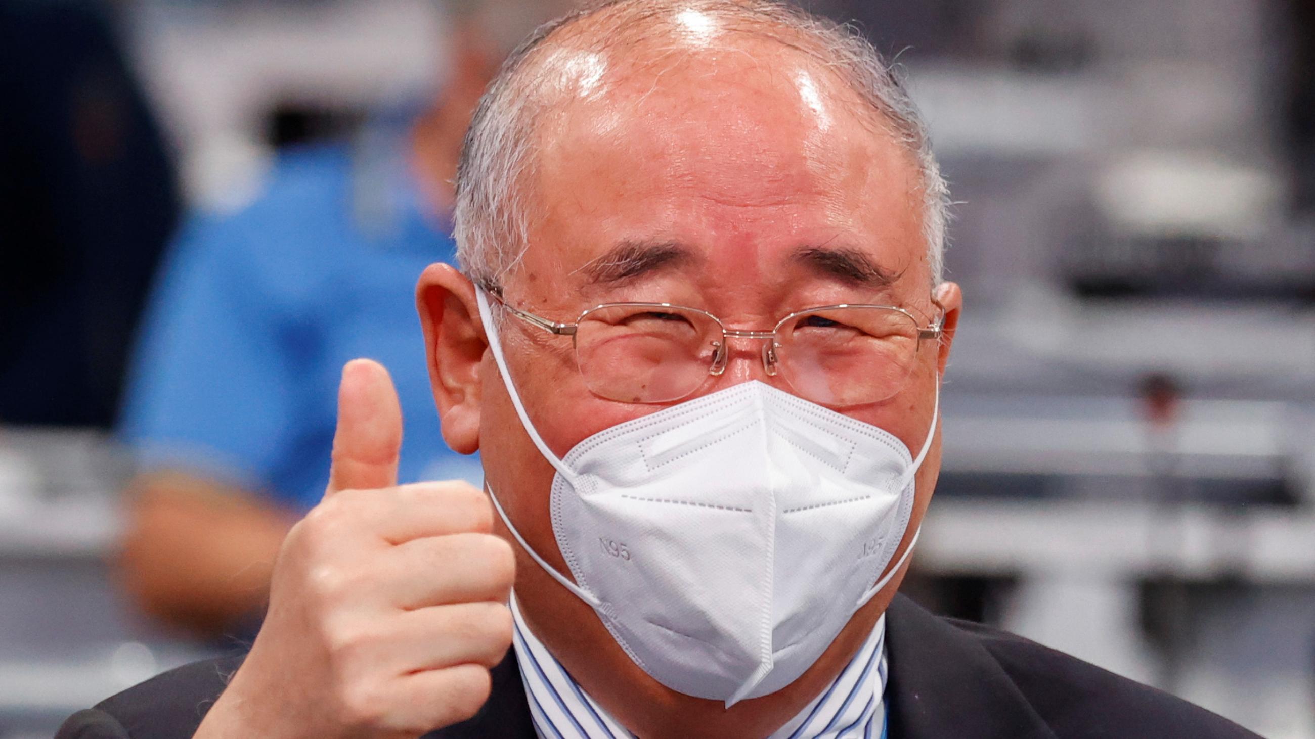 China's chief climate negotiator, Xie Zhenhua gives a thumbs up at aa COP26 meeting