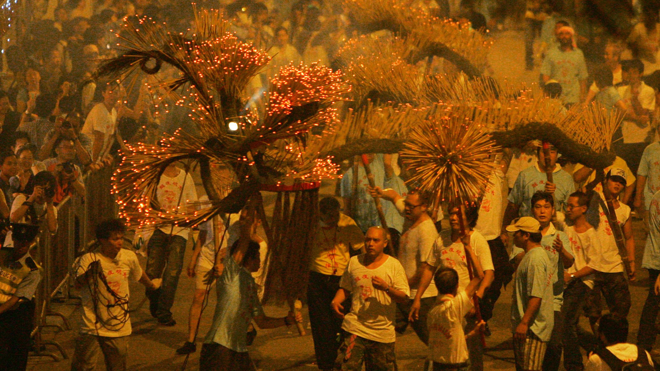 A "fire dragon" made from incense sticks is paraded at an event celebrating the mid-autumn festival in Hong Kong, on October 5, 2006.