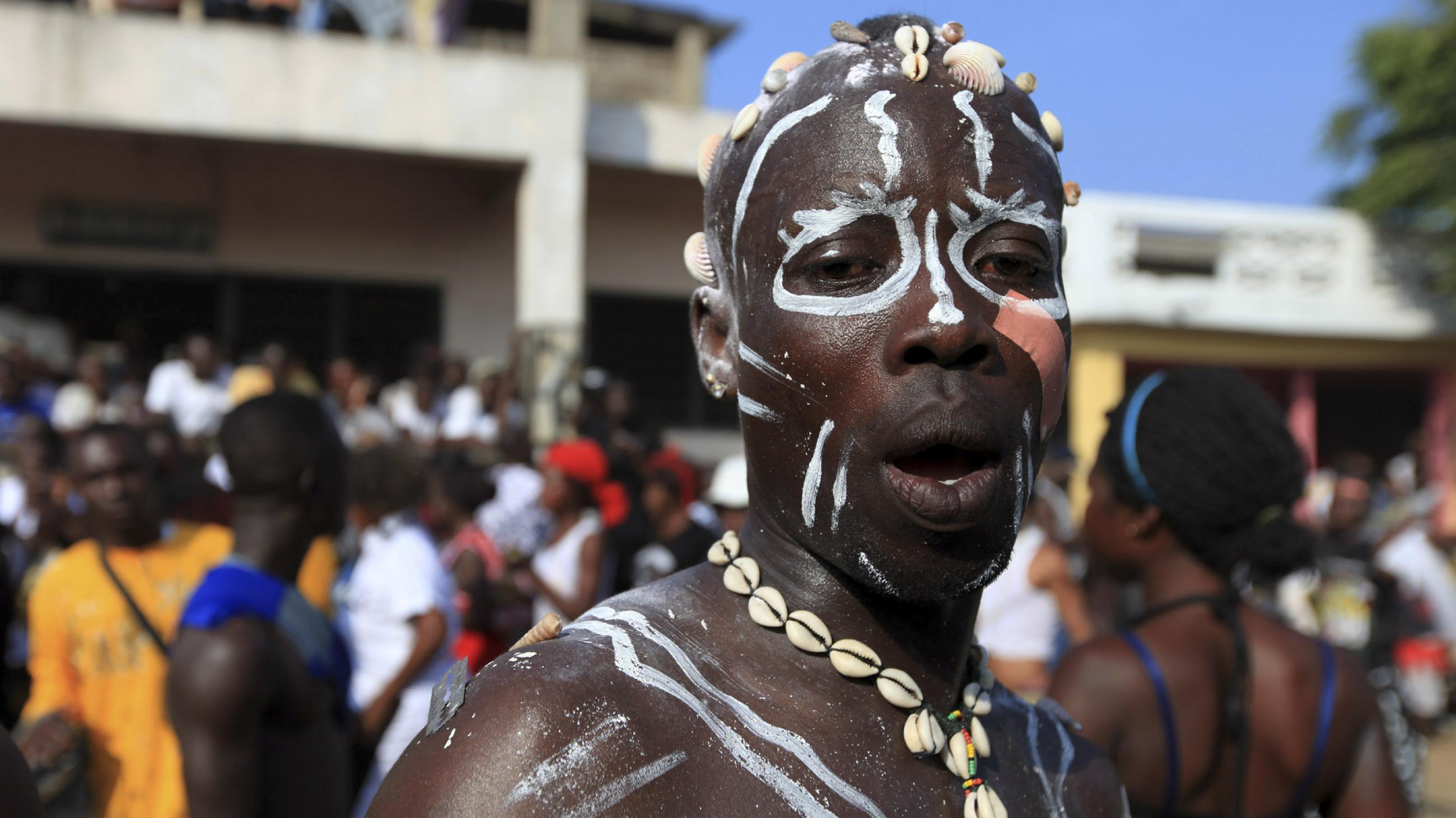 participant attends the Homowo traditional festival at Teshie community in Ghana's capital, Accra, September 5, 2009. Homowo festival marks the beginning of a new harvest and is celebrated by the Ga people around the coastal regions of Ghana.
