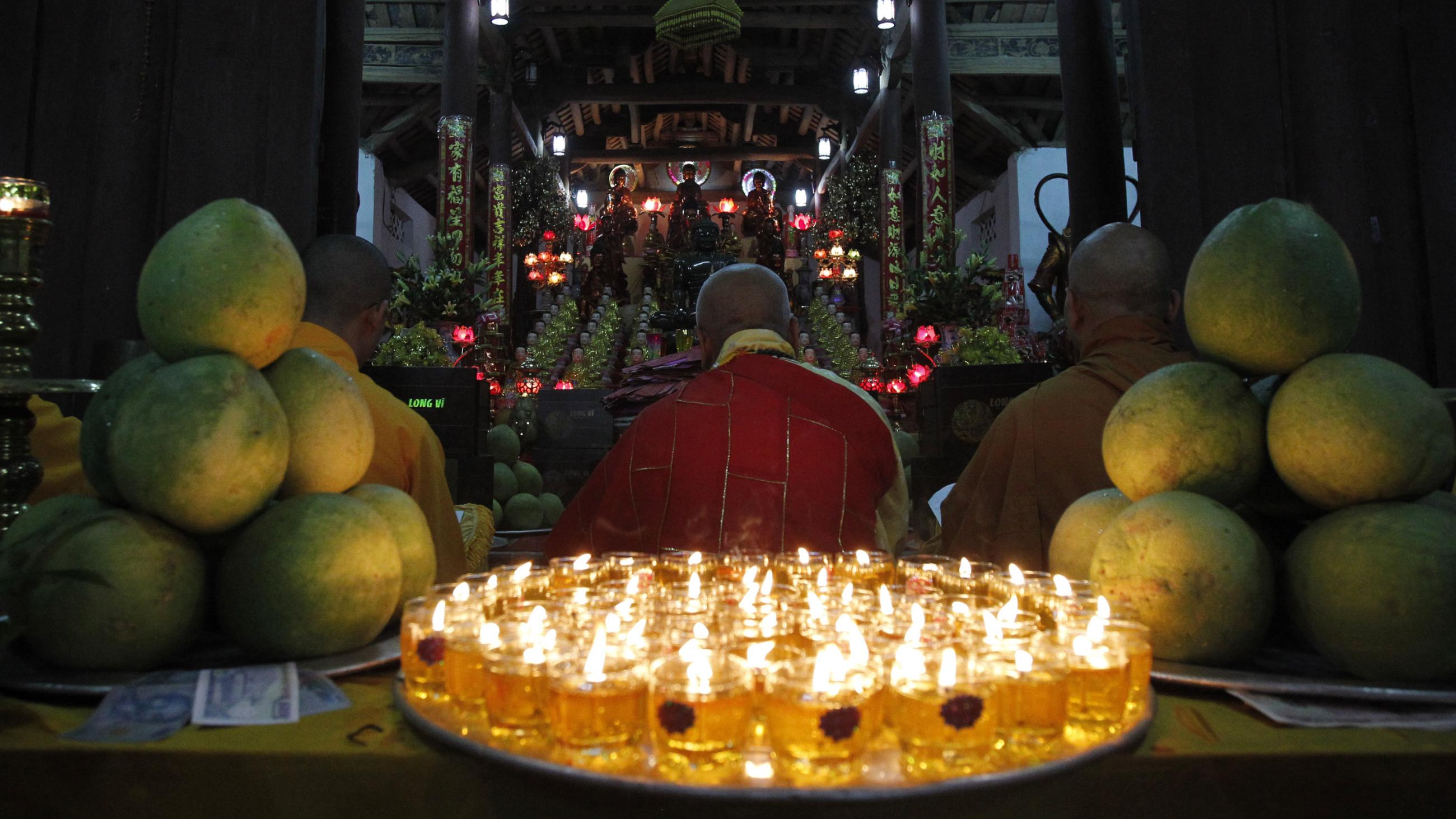Buddhist monks pray during a ceremony to celebrate the upcoming Mid-Autumn Festival at Duoc Thuong pagoda, outside Hanoi September 11, 2011. The Mid-Autumn Festival also known as Moon Festival which takes place on the 15th day of the eighth month of the Lunar calendar, this year falls on Monday September 12.