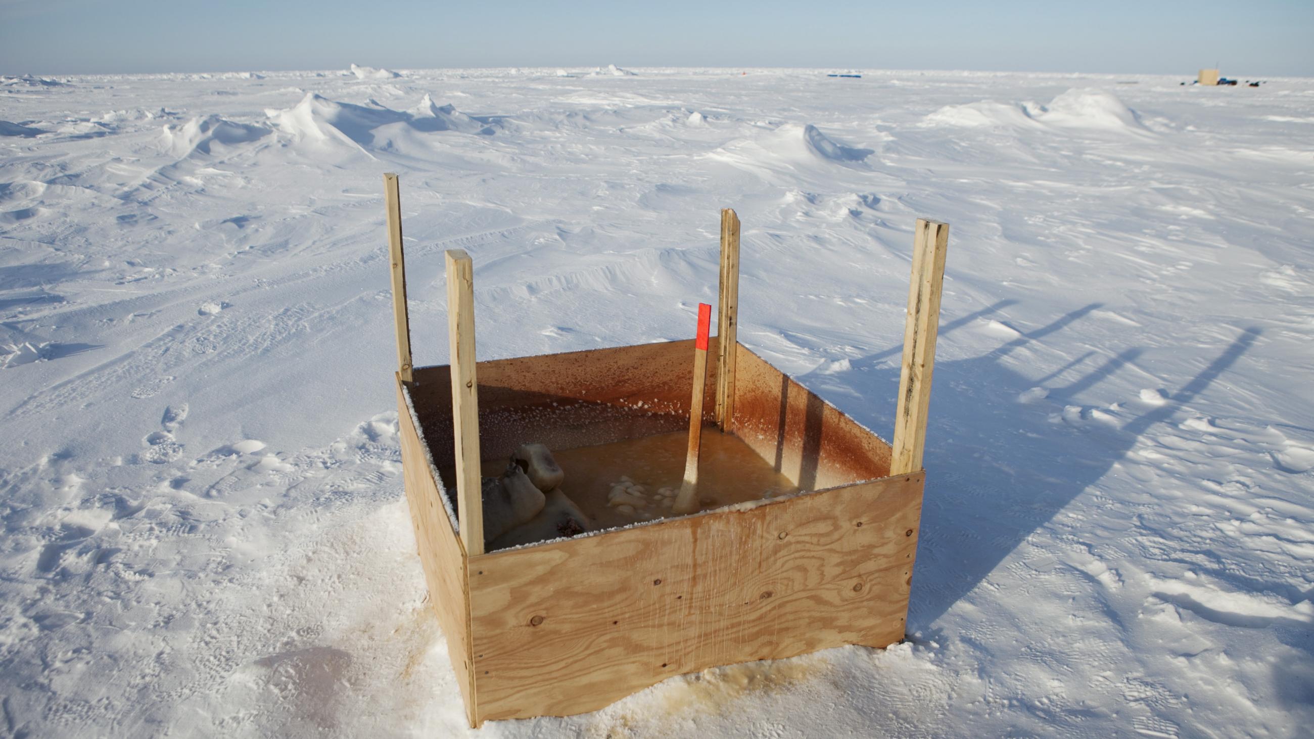 A public toilet stands surrounded by snow near the 2011 Applied Physics Laboratory Ice Station north of Prudhoe Bay, Alaska, March 18, 2011.