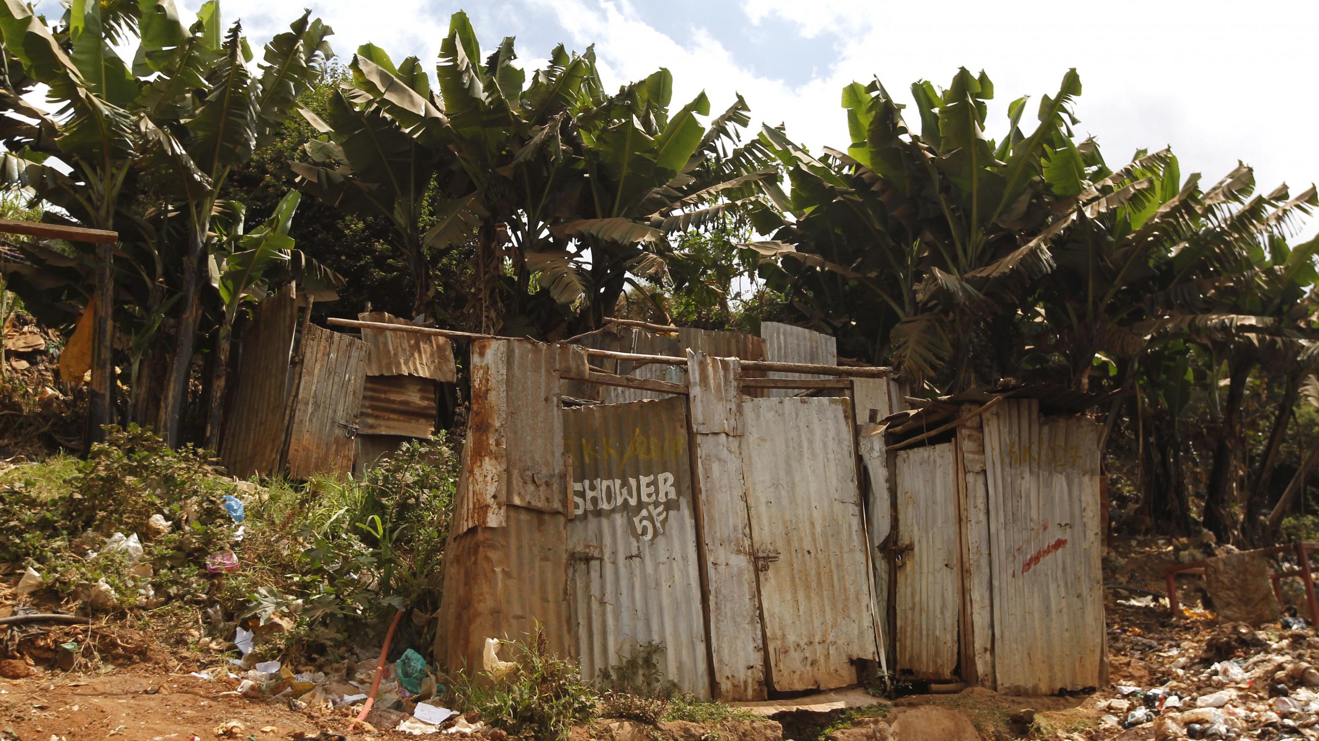 A public toilet constructed of rusty sheets of metal stands in Gatwekera Village in the Kibera slum, in Nairobi, Kenya, on October 12, 2015. 