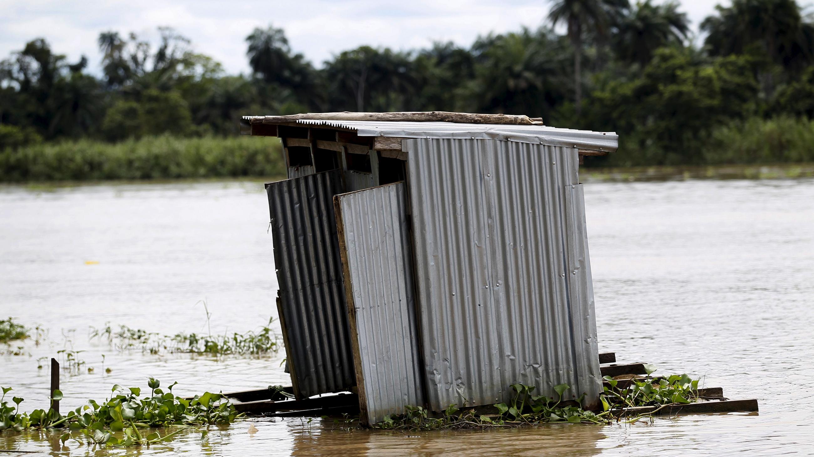 A toilet floats on the river Nun near Yenagoa, Bayelsa state in Nigeria's delta region October 8, 2015.