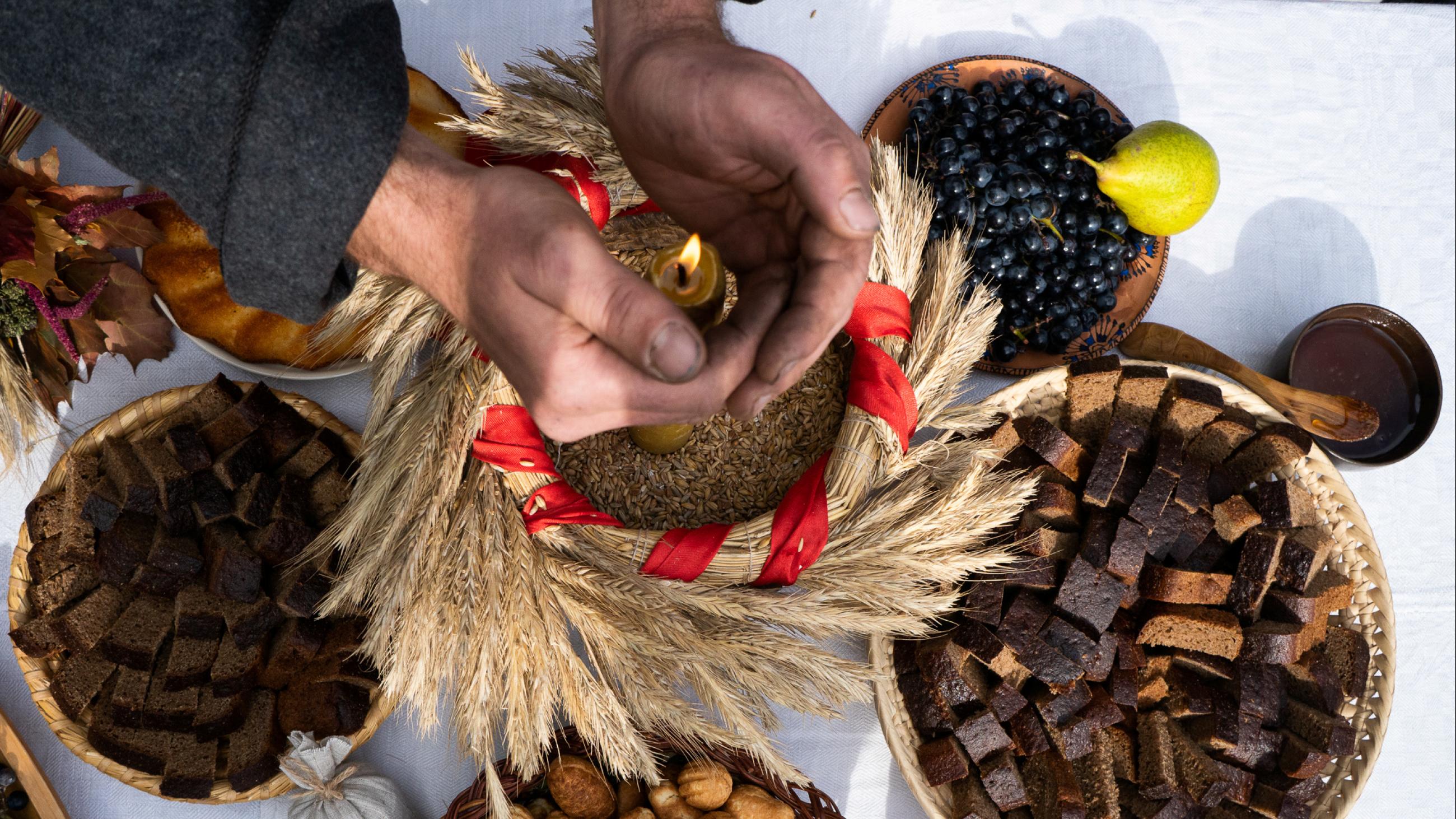 A man takes part in the autumn festival of traditional culture "Bagach", which marks the end of the harvest, at the Yanka Kupala State Literary Museum near the village of Vyazynka, Belarus, on September 29, 2019.