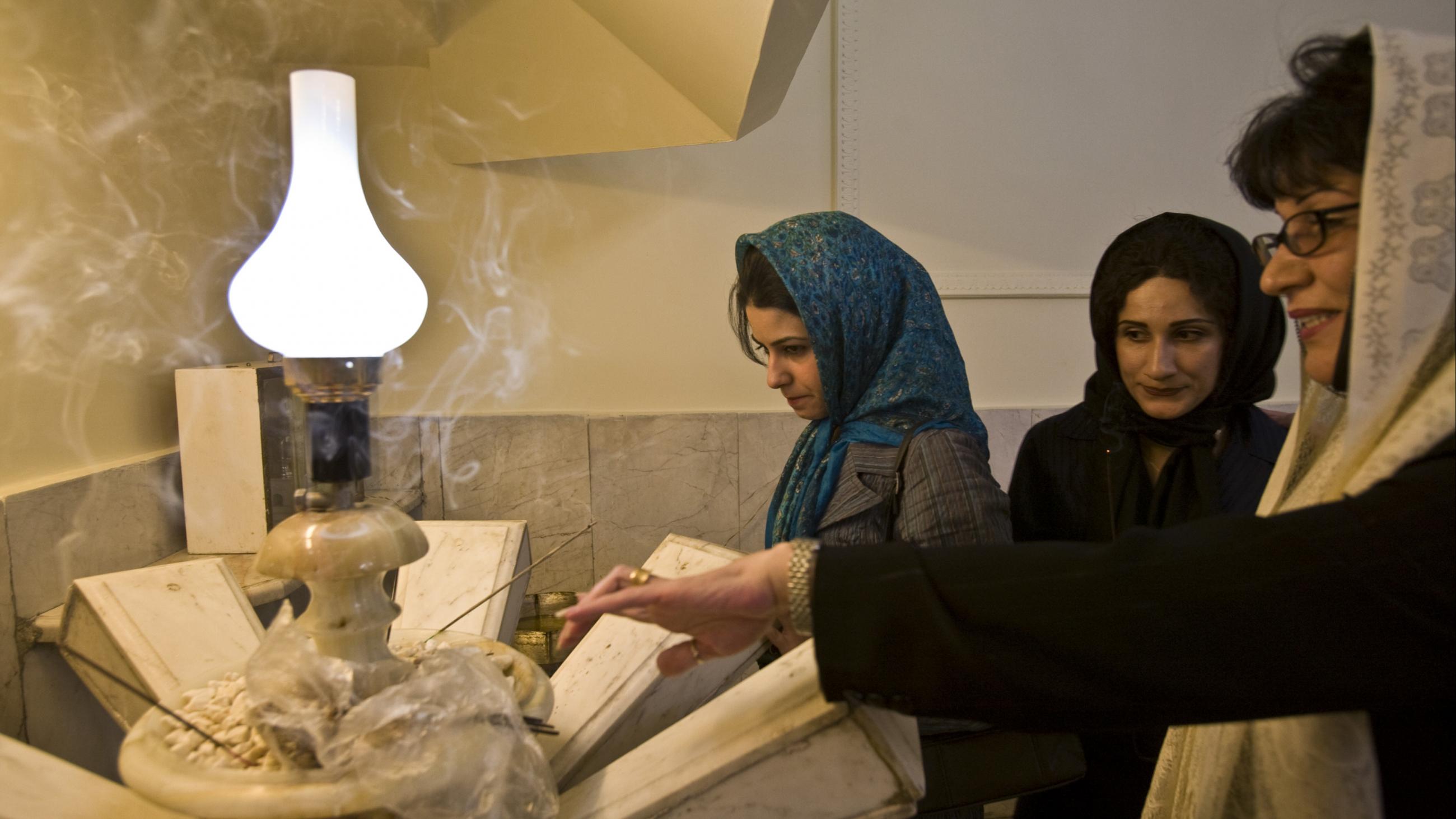 Iranian Zoroastrians pray during the historic Mehregan celebration in Tehran, on October 1, 2008. Zoroastrians living in Iran hold the Mehregan ceremony to thank God for a good summer and cold winter during the first ten days of autumn.