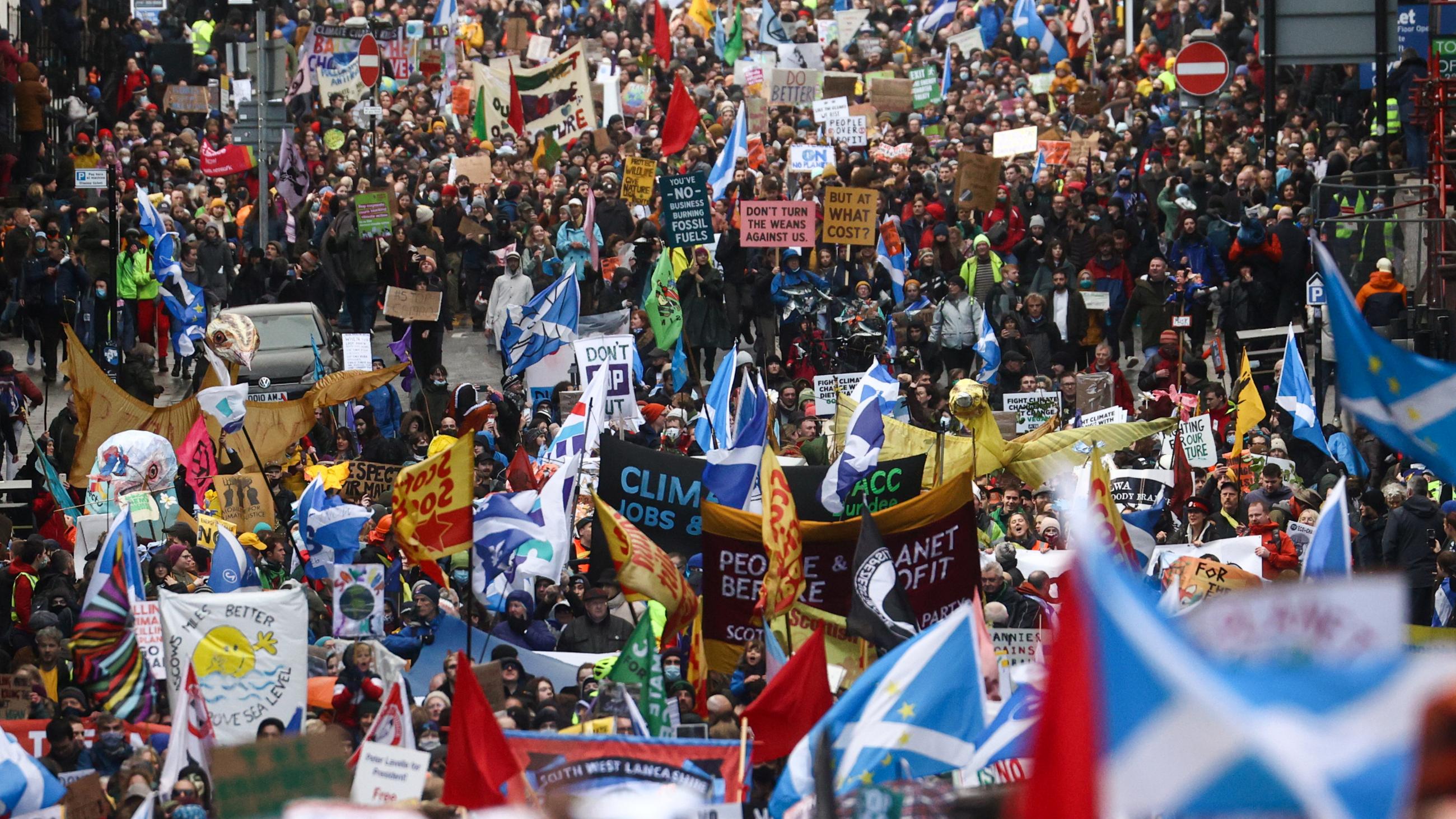 Crowds demonstrate in the streets in Glasgow, Scotland, on November 6, 2021.