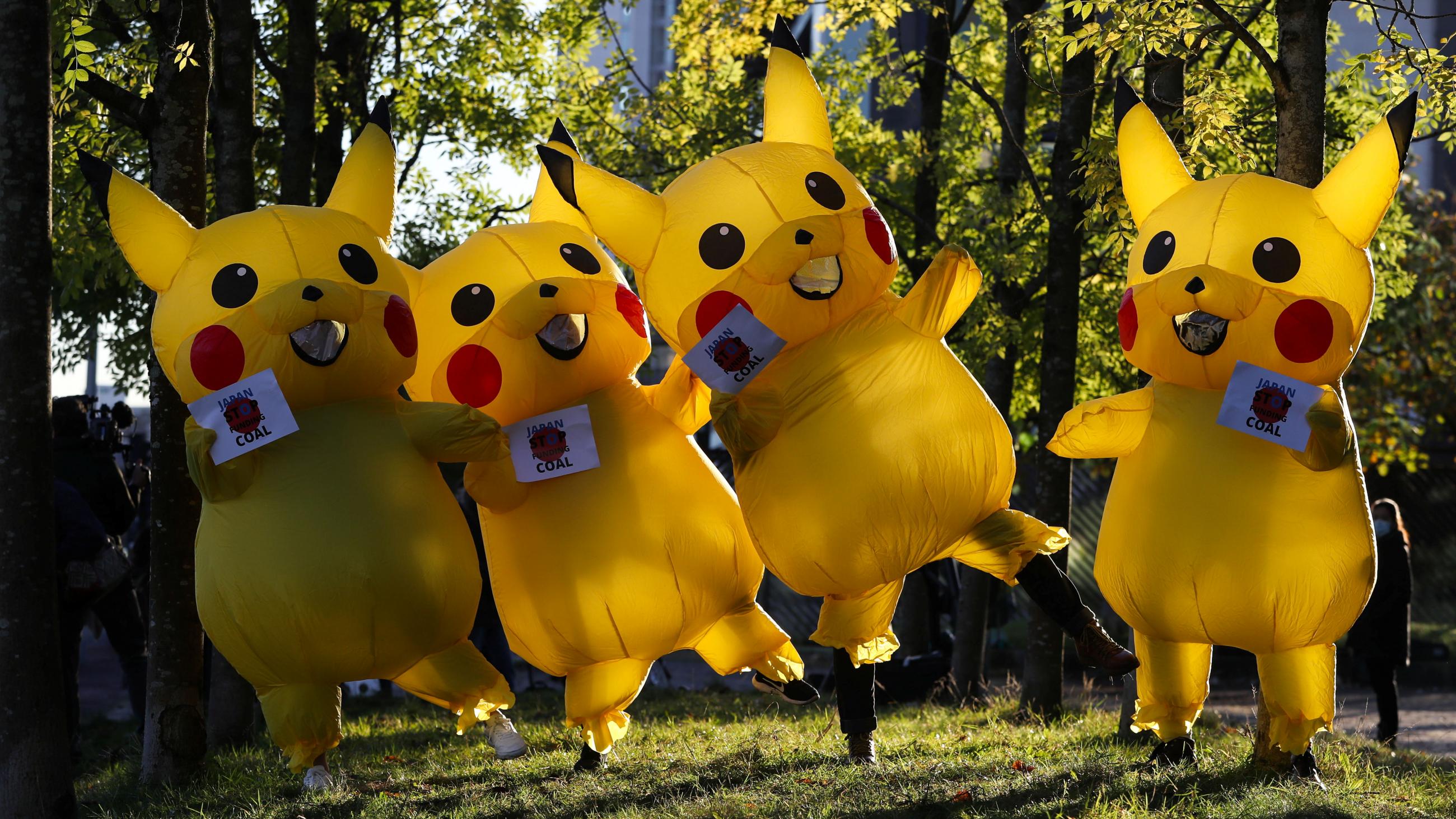 People dressed as Pikachu—a character from Pokémon—protest against the funding of coal by Japan, near the COP26 conference venue in Glasgow, on November 4, 2021.