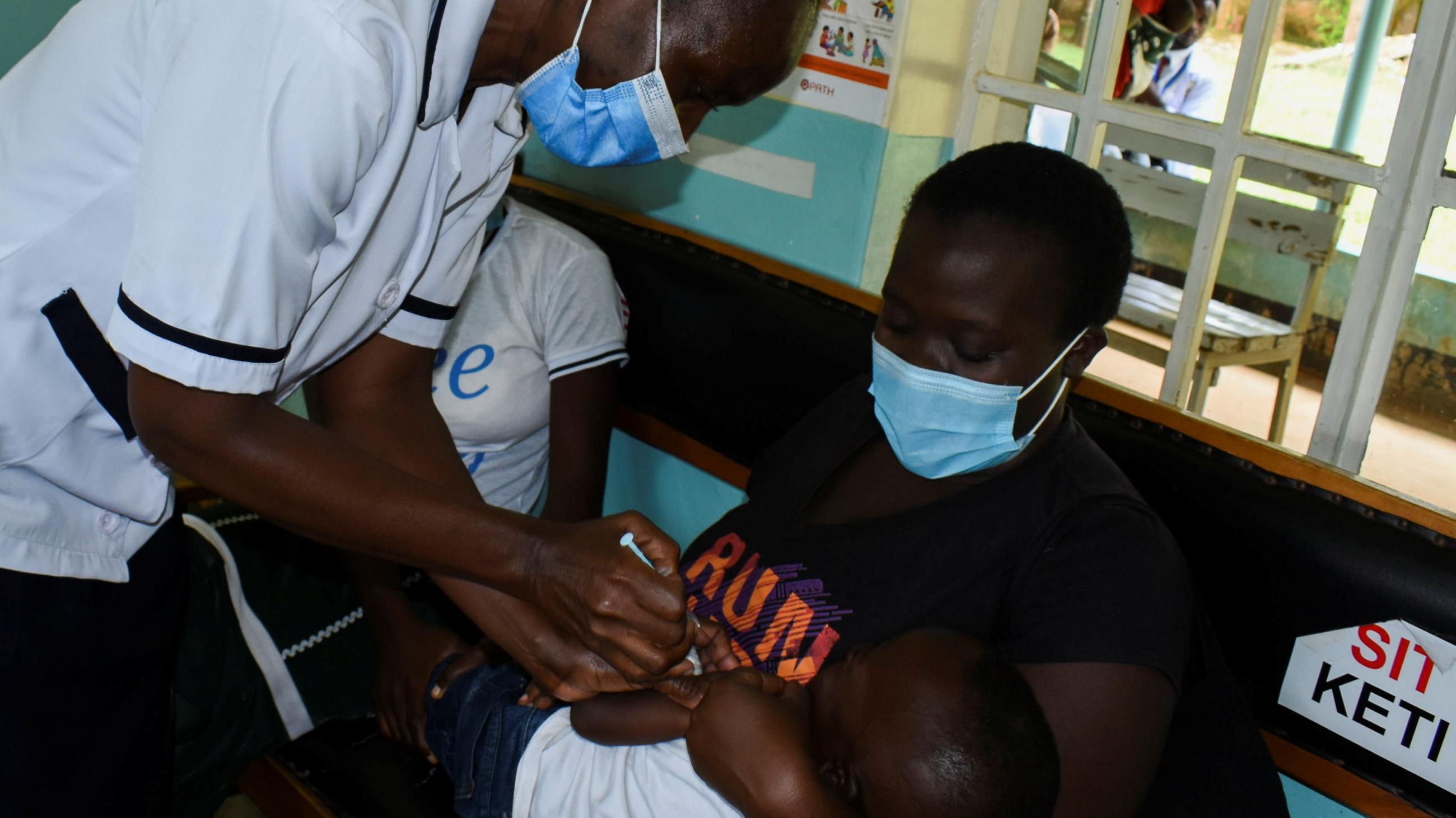 Pamela Omboko, a nurse at the Yala Sub-County Hospital Mother and Child Healthcare clinic in Kenya prepares to vaccinate a child against malaria