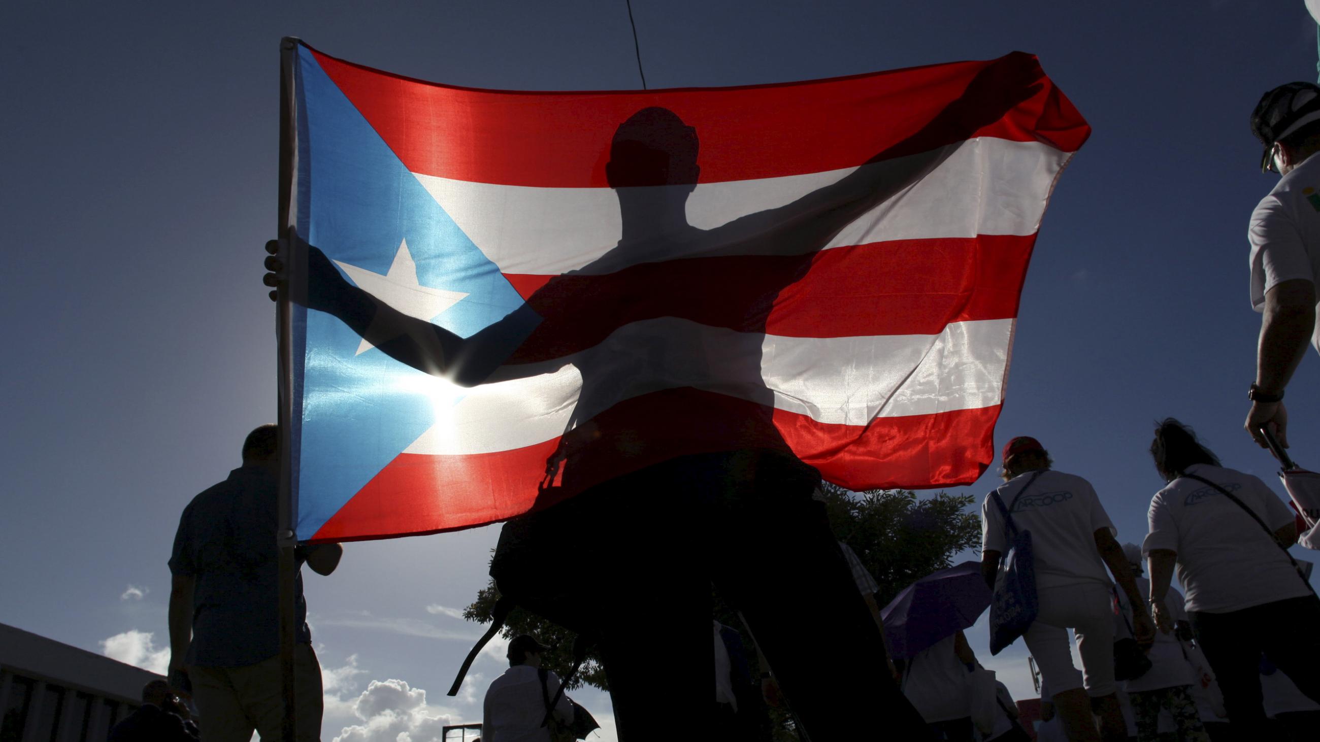 People protesting for improved health benefits in San Juan, the capital of Puerto Rico, and its largest city.