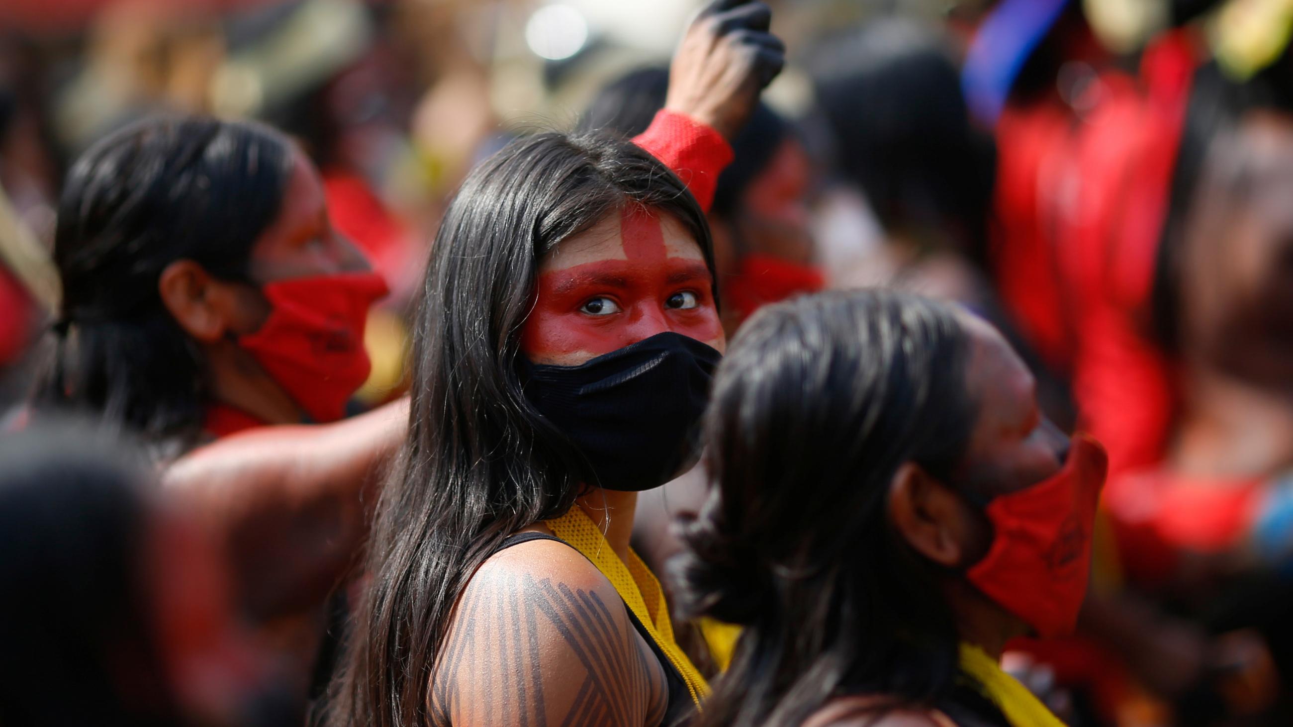 Women participate in a second march of indigenous women to protest Brazil's President Jair Bolsonaro and his leadership during the COVID-1 pandemic.