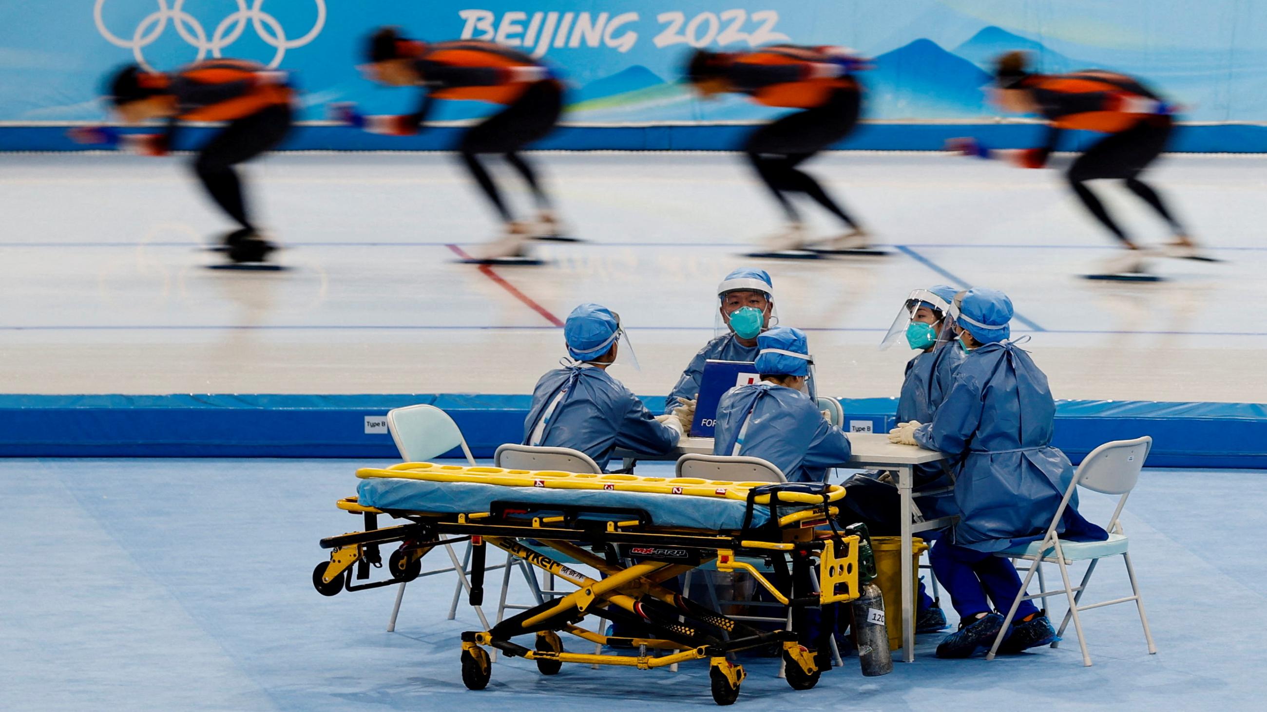 Medical staff in personal protective equipment are seen at a speed skating training session for the Beijing 2022 Winter Olympics in Beijing, China, January 28, 2022