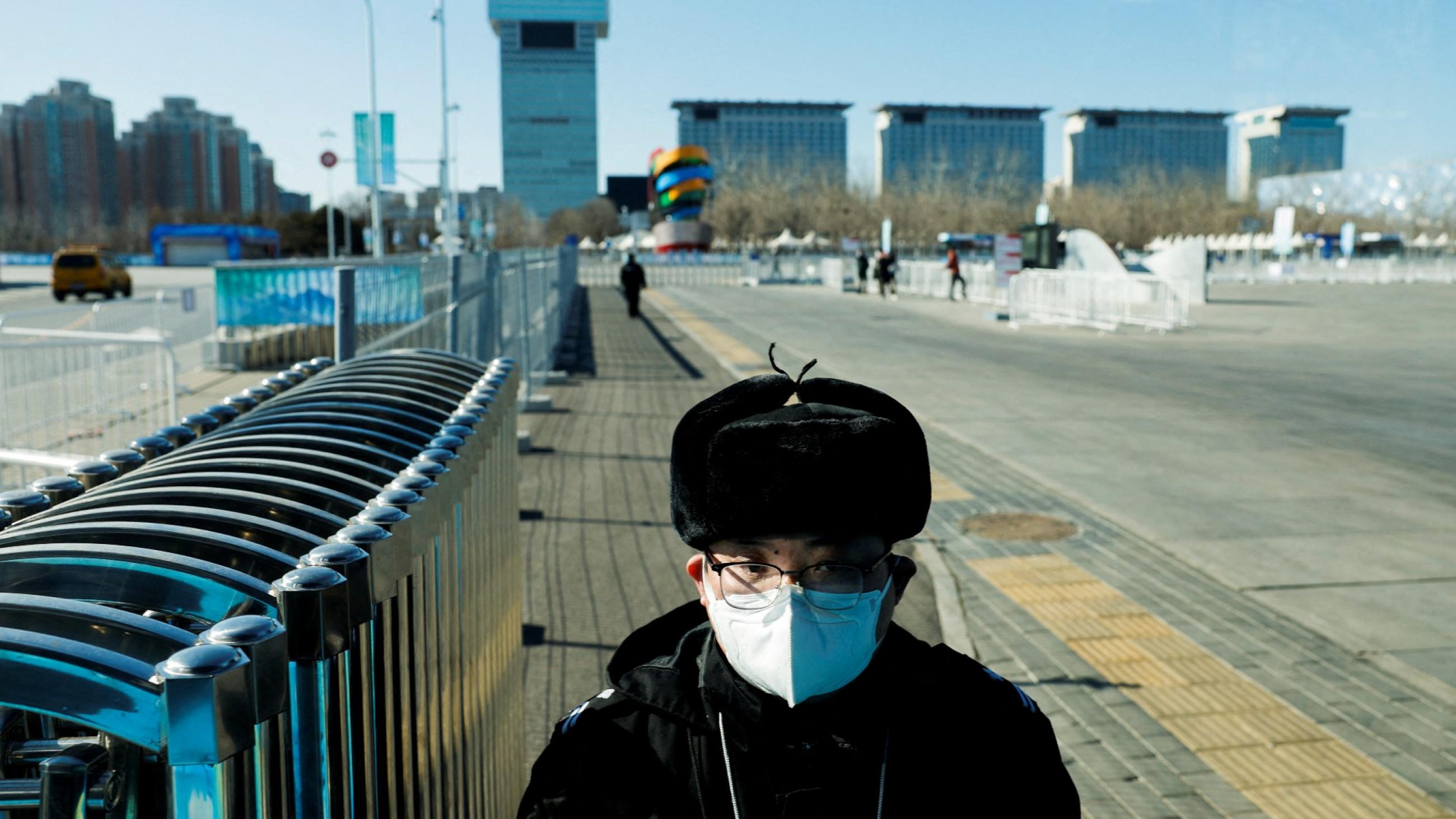 A security personnel stands guard at a closed loop bubble area, ahead of Beijing 2022 Winter Olympics, in Beijing, China, February 1, 2022. 