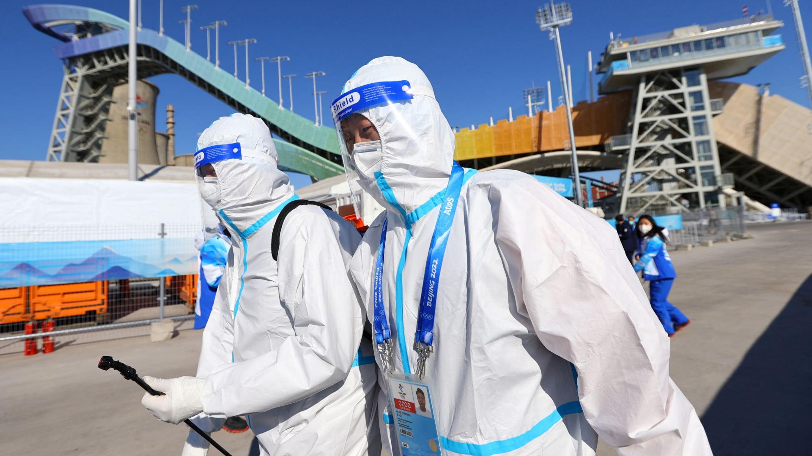 Staff members in personal protective equipment (PPE) during training