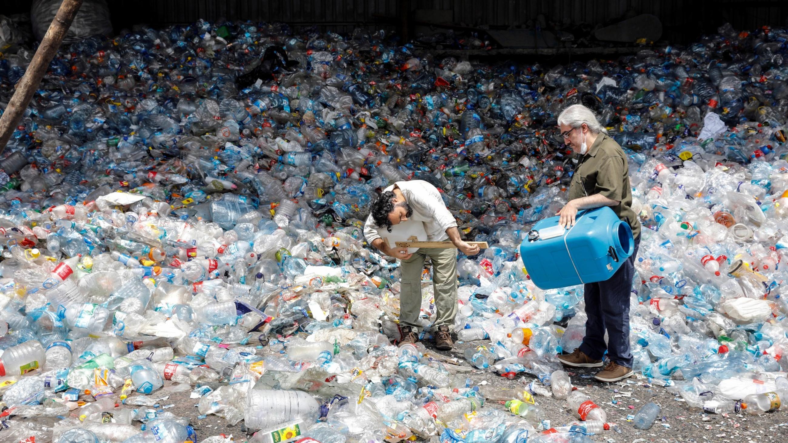 members of the ethnic instrumental music band Fungistanbul, perform with instruments made out of materials collected from landfills, at a recycling depot in Istanbul