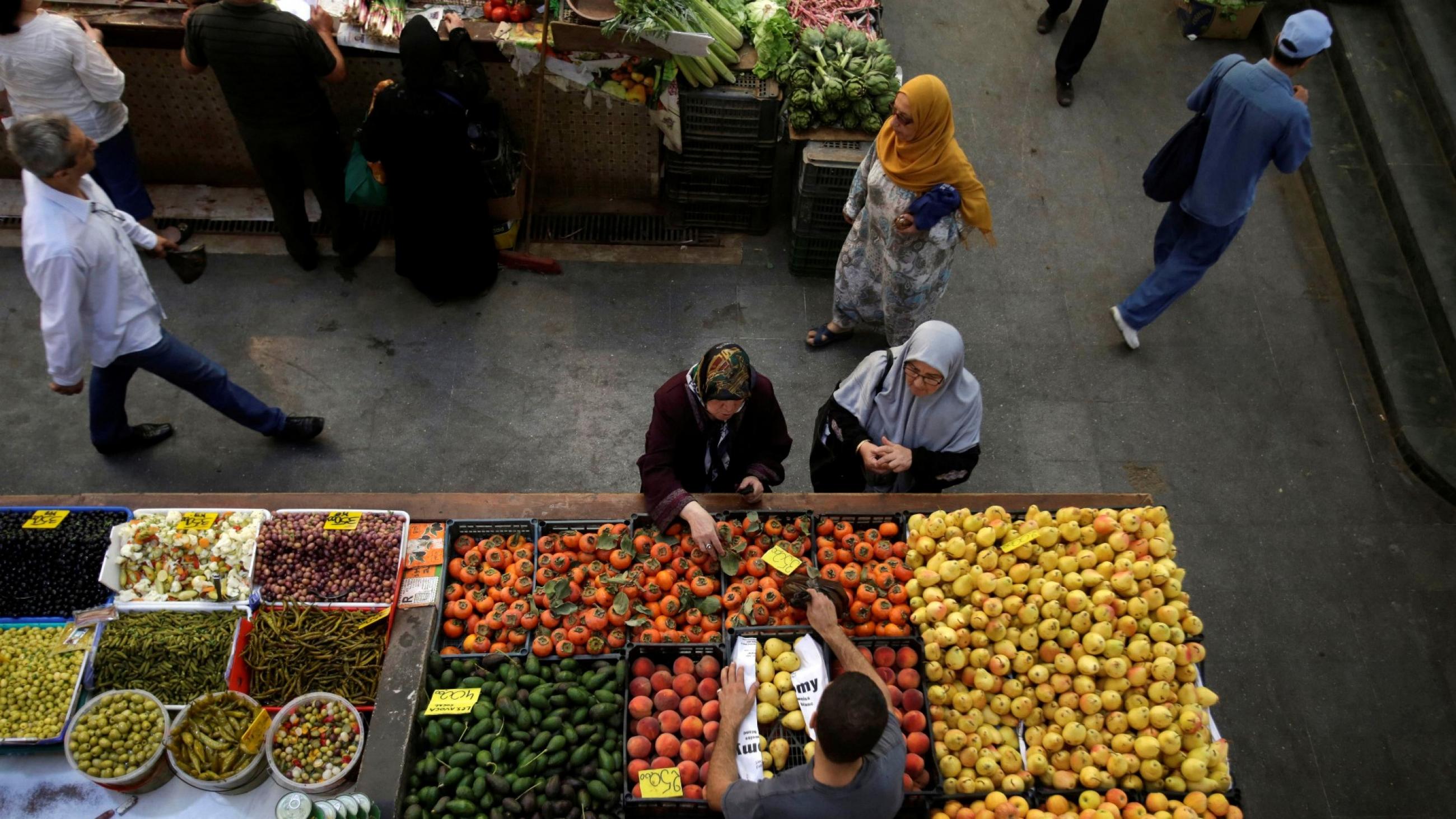 DOCUMENT DATE:  November 21, 2017  People buy vegetables and fruits in a market in Algiers, Algeria October 15, 2017. 