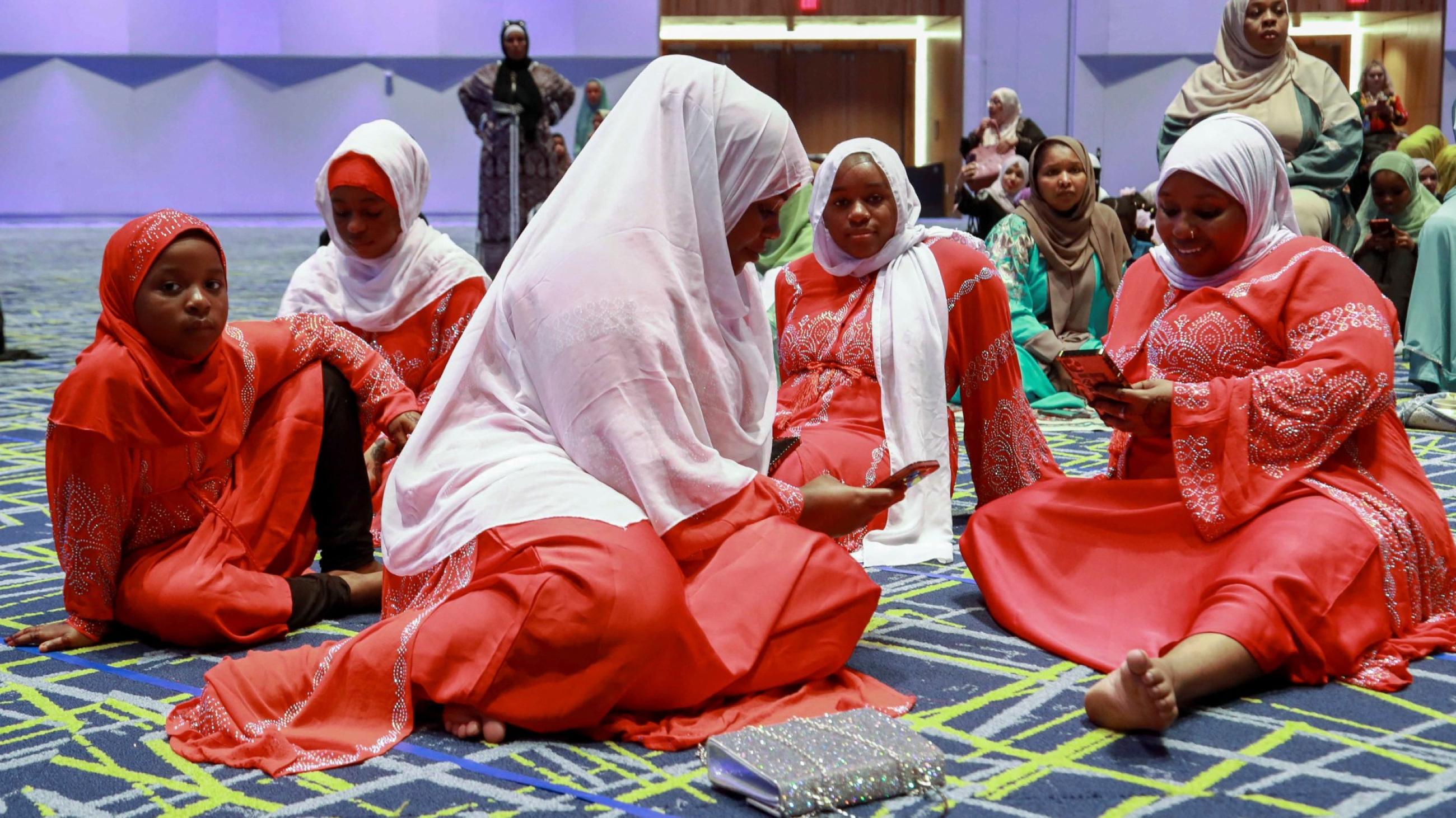 The Alis, an immigrant family from Kenya, gather with the Muslim community at Kentucky International Convention Center to celebrate the Eid al-Adha festival, in Louisville, Kentucky, on July 9, 2022. 