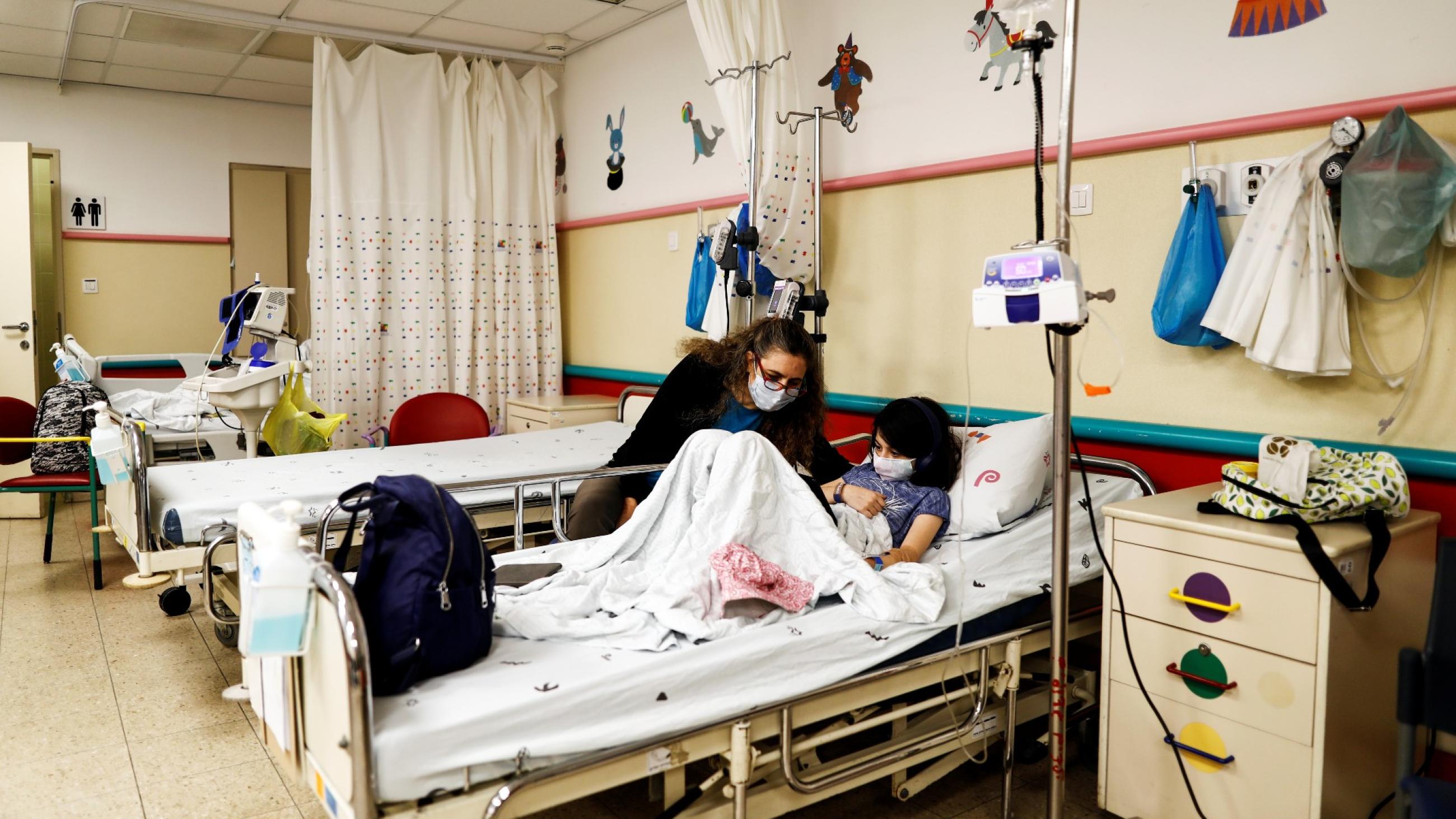 Noa, a 10-year-old Israeli girl suffering from Long Covid, chats with her mother in a post-coronavirus disease (COVID-19) clinic in Schneider Children's Medical Center, in Petah Tikva, Israel December 6, 2021. 