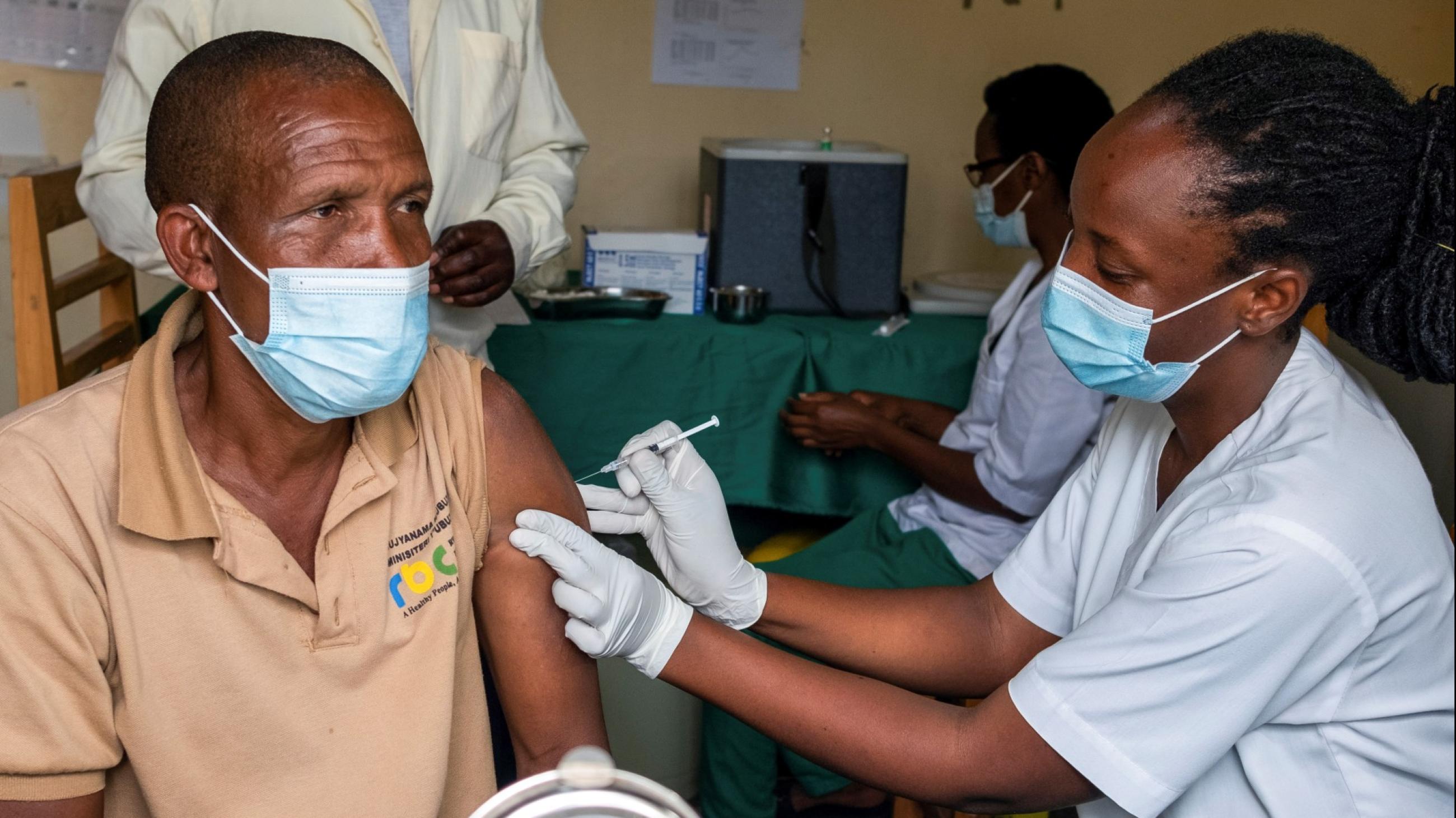 A syringe and a vial with vaccine against COVID-19 are seen at the Masaka hospital in Kigali, Rwanda, on March 5, 2021.