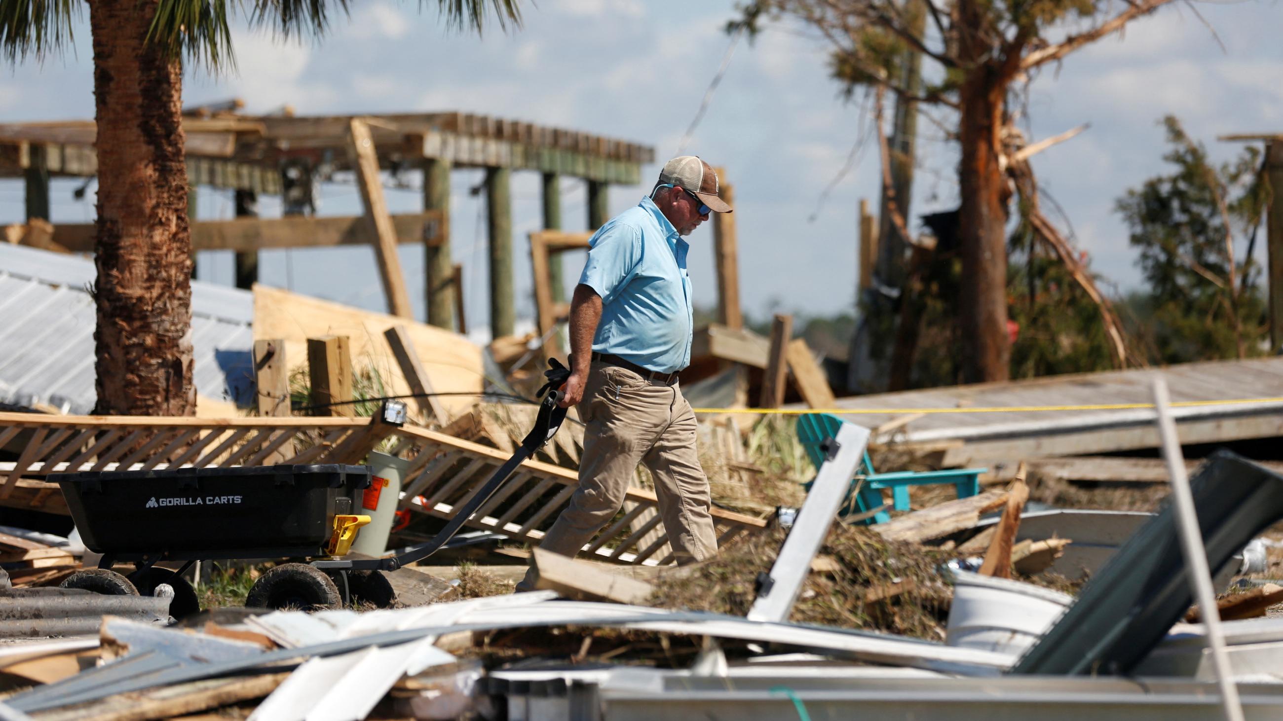 A resident of Keaton Beach works to recover their belongings from their home after Hurricane Helene passed through the Florida panhandle.