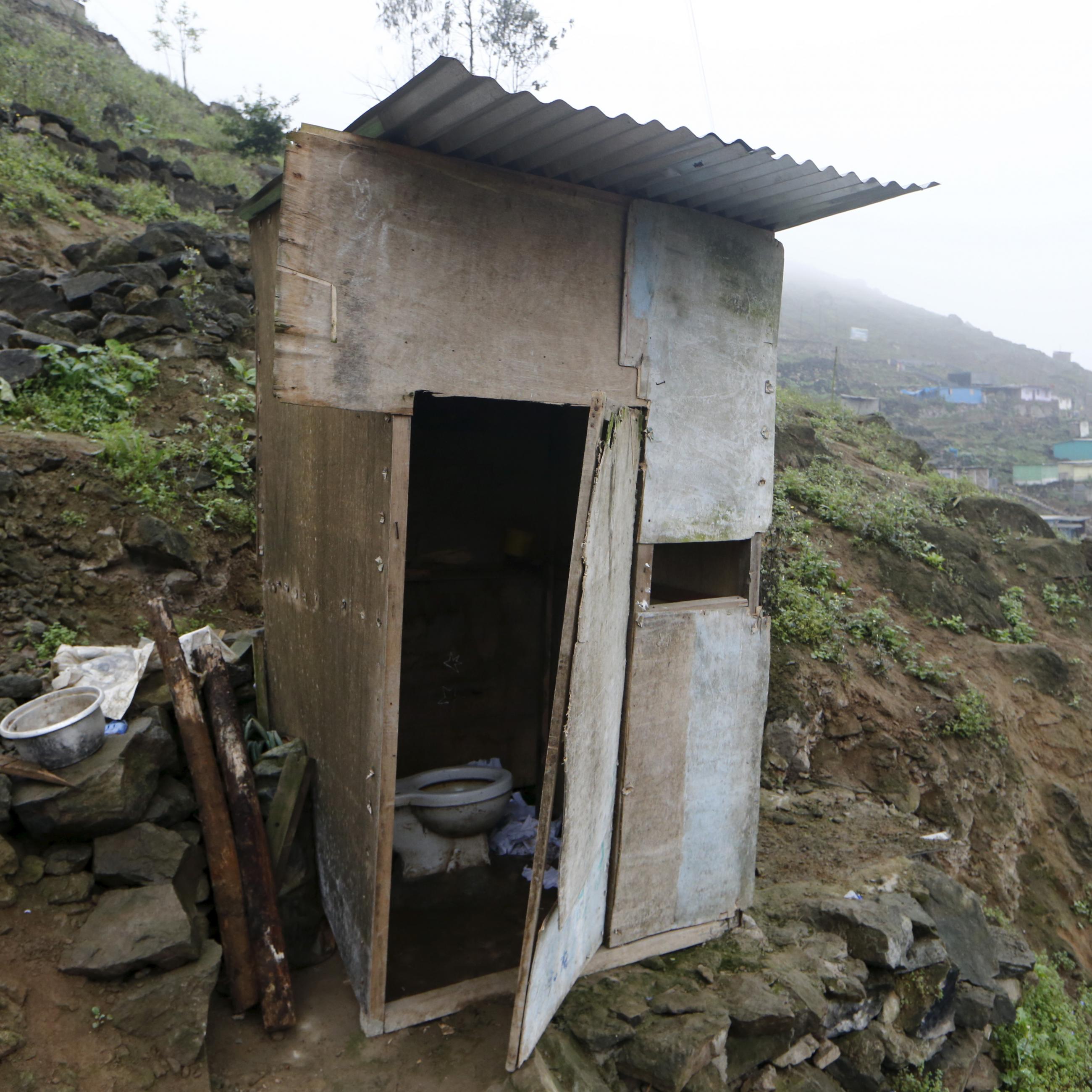 A toilet stands outside the Llamocca family home at Villa Lourdes in Villa Maria del Triunfo on the outskirts of Lima, Peru, October 7, 2015. There is no running water in Villa Lourdes and families buy it from water tankers once a week. 