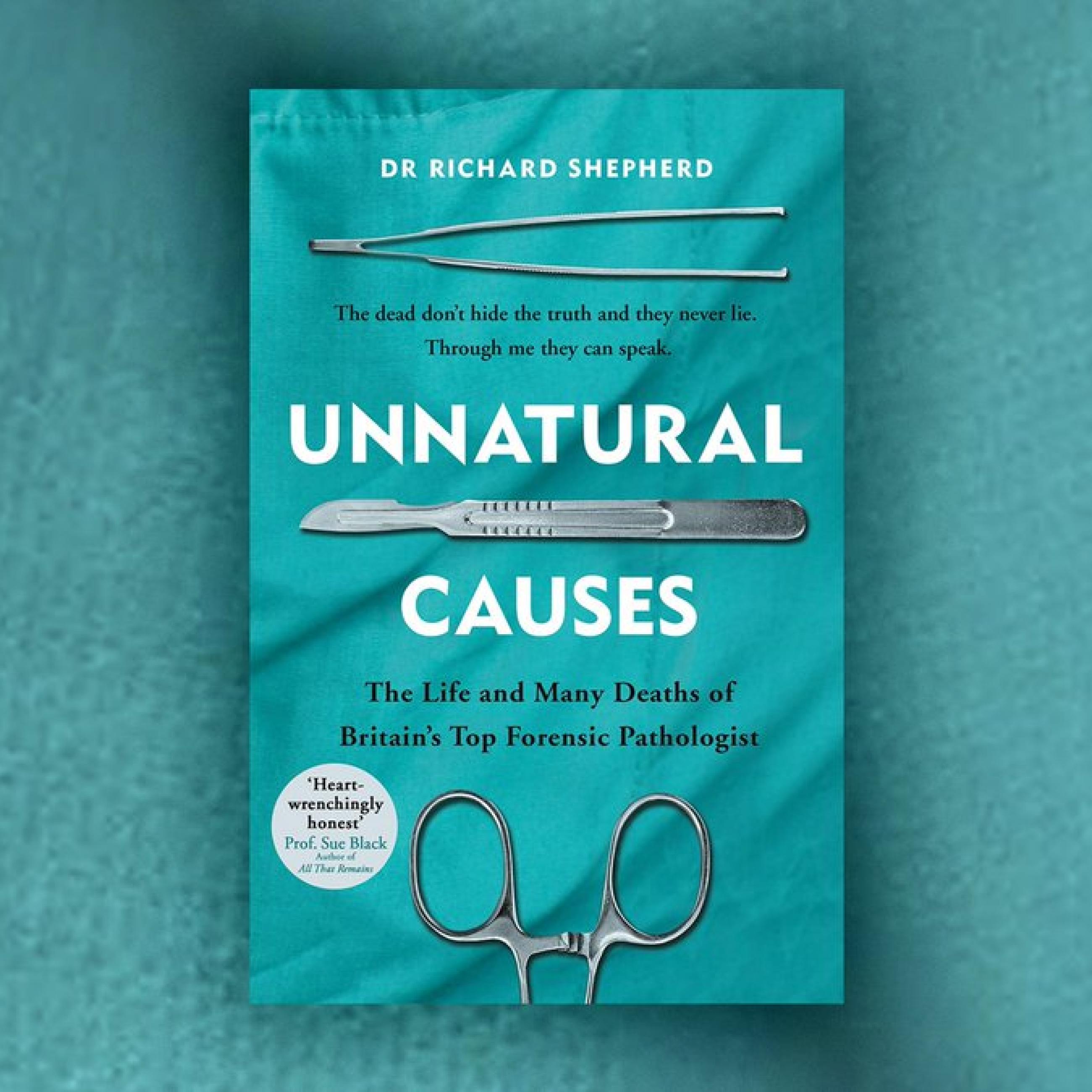 Photo of a turquoise book cover reading "unnatural causes" in white font 