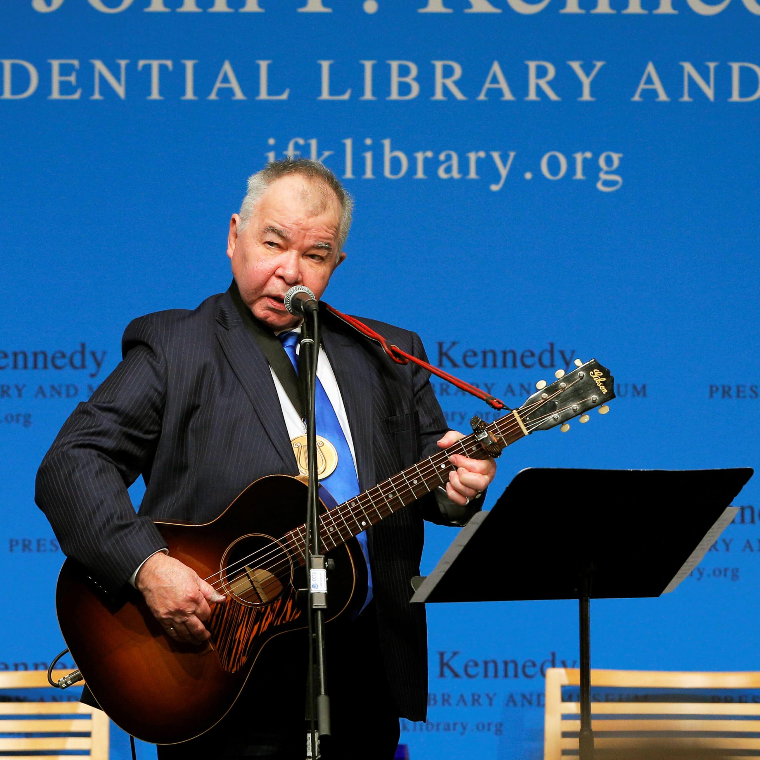 Musician John Prine performs after accepting his PEN New England Song Lyrics of Literary Excellence Award during a ceremony at the John F. Kennedy Library in Boston