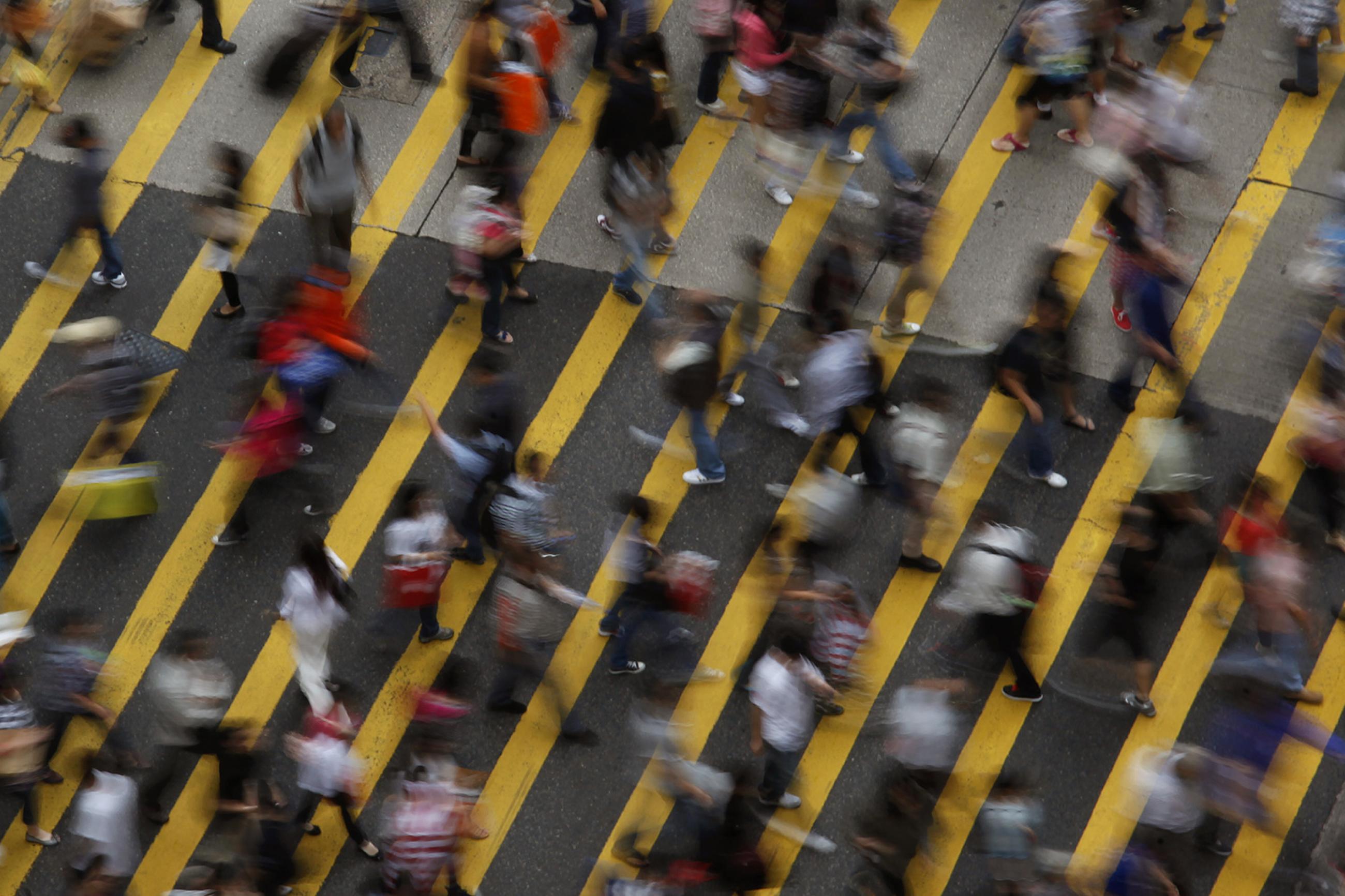 You wouldn’t know it from this image of hustle-bustle on the streets of the Mong Kok district in Hong Kong on Oct. 4, 2011, but the workforce in many Asian economic powerhouses is steadily shrinking. Picture shows the street from above, a wide pedestrian walkway with broad yellow lines painted at an angle. Dozens of people can be seen in the frame, all blurred due to fast movement and a slow shutter. REUTERS/Bobby Yip