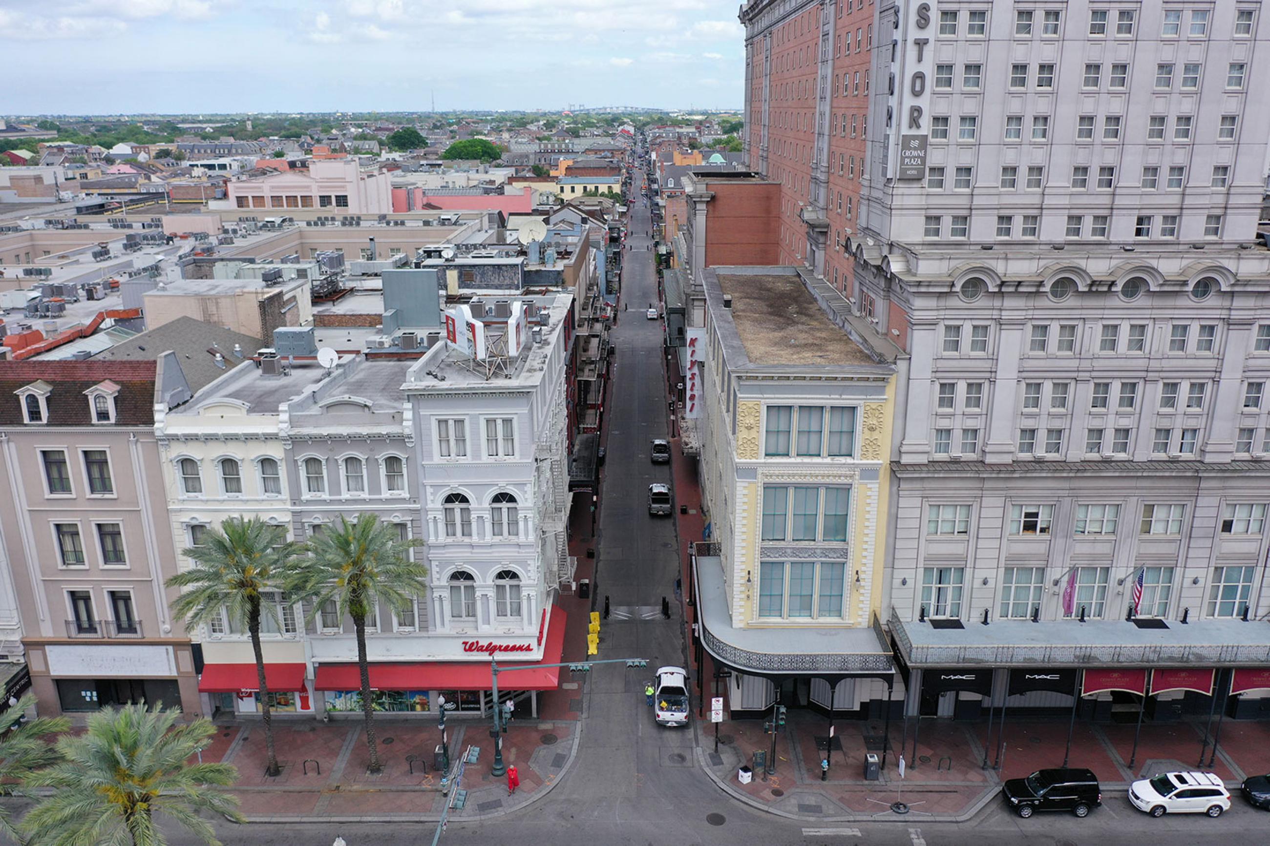 Normally bustling tourist mecca Bourbon Street lies deserted in the early afternoon during shelter in place orders to slow the spread of coronavirus in a photograph of New Orleans on March 27, 2020. The photo shows a view of the entrance to Bourbon street, which would normally be packed with tourists and other people, almost completely empty. REUTERS/Drone Base