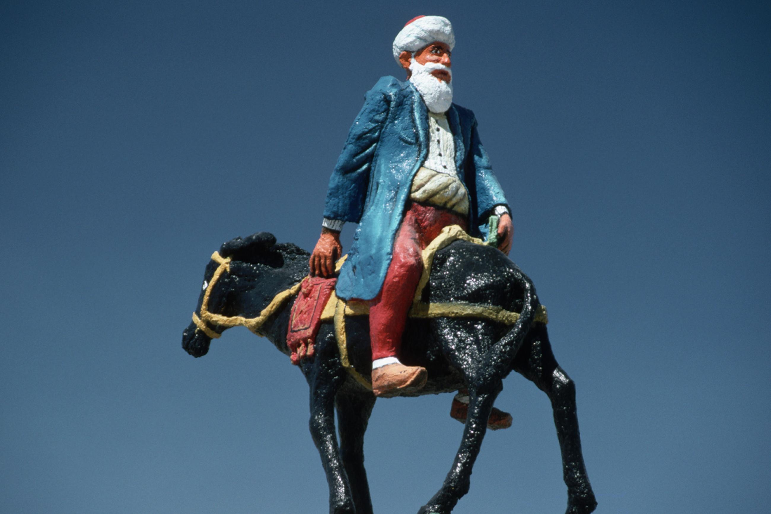 Statue of the Turkish Folkloric Figure Nasreddin Hoca, who looked for his keys in a well-lit place because it was too dark to look for them where they were. Photo shows a statue of the famous figure riding backward on a donkey. GETTY Images/Corbis/Chris Hellier