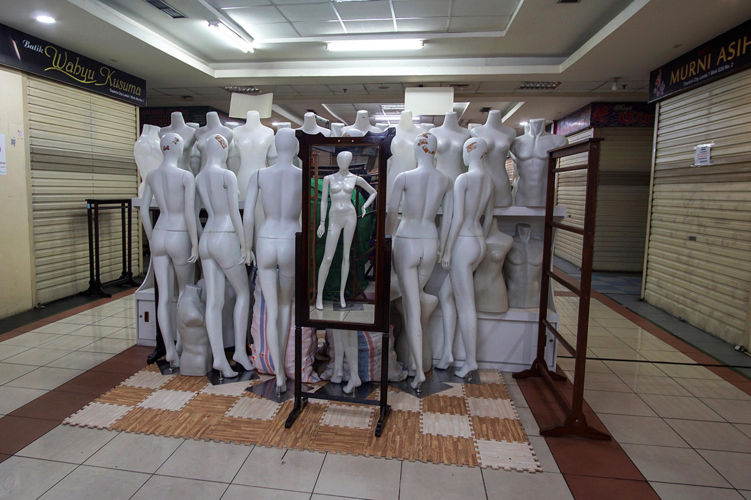 Virtual shoppers: mannequins are pictured in the middle of a corridor at a closed shopping mall amid the spread of coronavirus disease (COVID-19) in Jakarta, Indonesia March 31, 2020. This is a powerful photo of an intriguing subject matter—a bunch of mannequins stacked up in the middle of a corridor. REUTERS/Fransiska Nangoy 