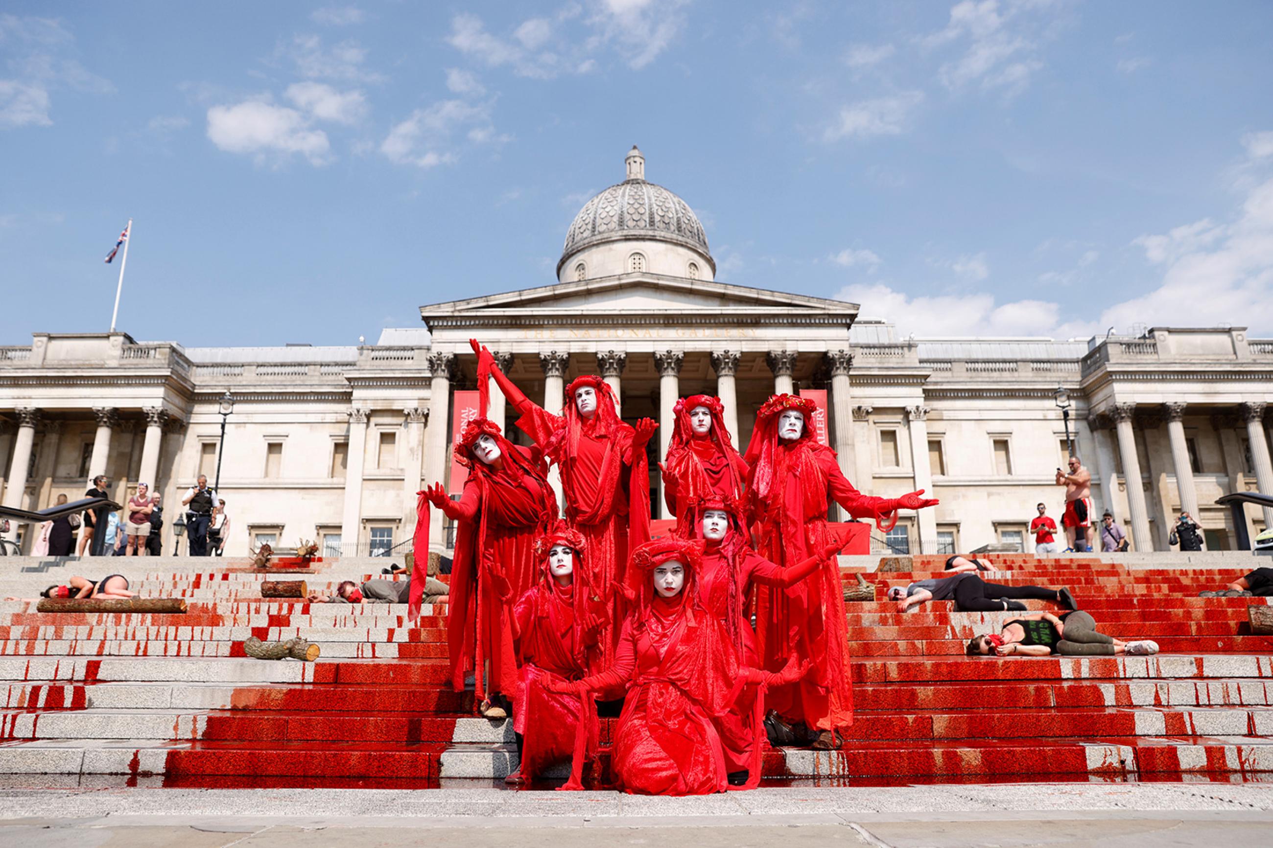 COVID-19 has seen its share of protest and political theater—like one in London on August 9, 2020, to call attention to Brazil, a country also subject to conspiracy theories over the virus' origins. The photo shows a crowd of performance artists demonstrating with costumes and fake blood splashed everywhere. REUTERS/John Sibley