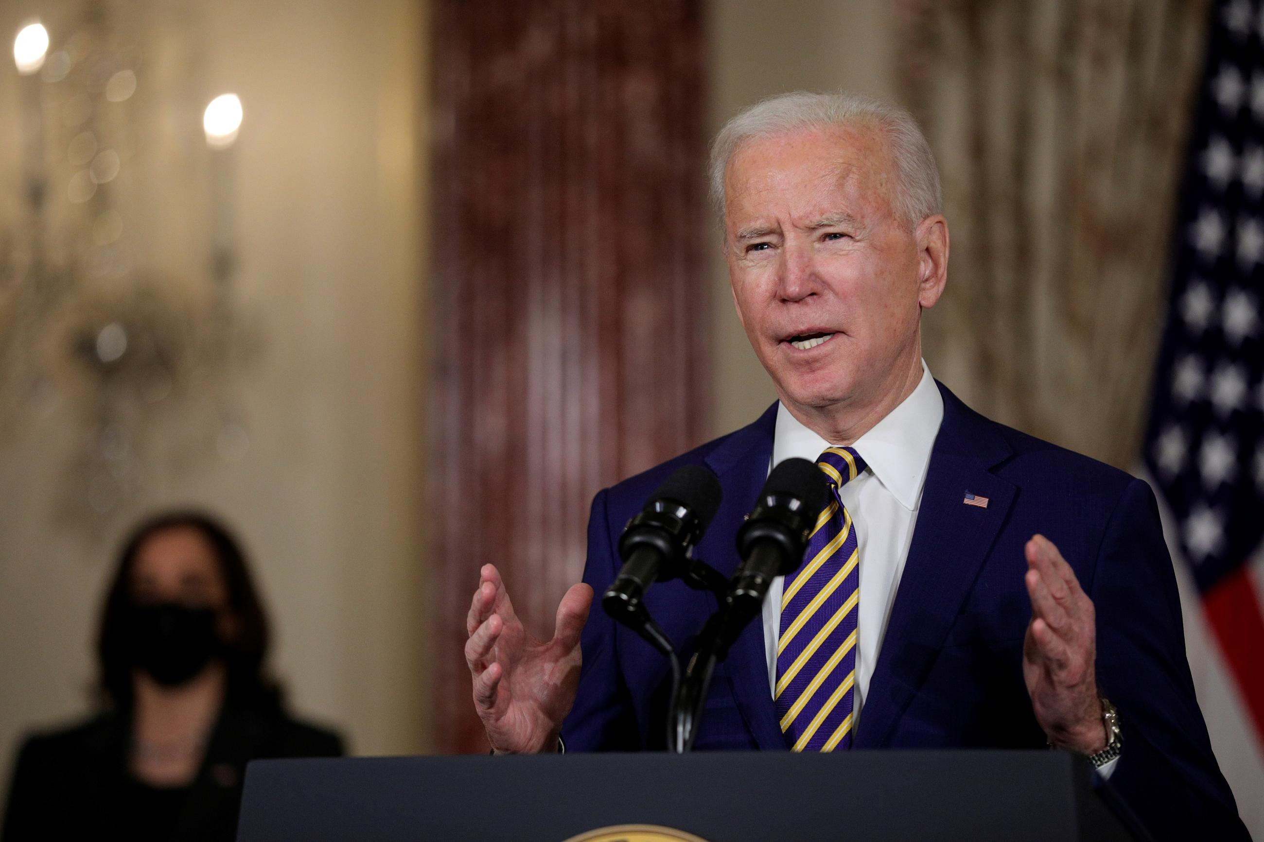 U.S. President Joe Biden delivers a foreign policy address as Vice President Kamala Harris listens, at the State Department in Washington, DC on February 4, 2021.