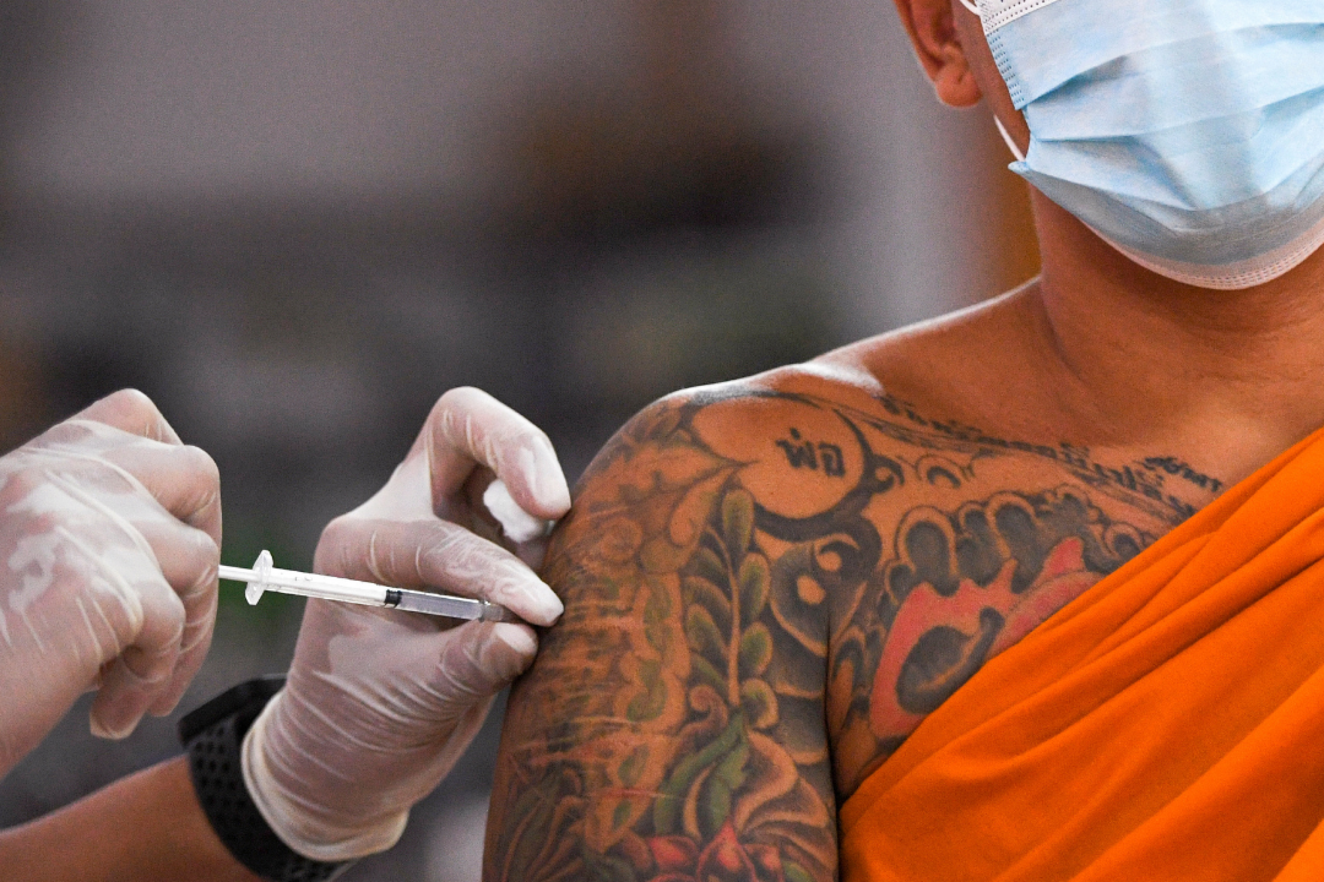 A Buddhist monk receives a Sinovac COVID-19 vaccine in Bangkok, Thailand on April 2, 2021. REUTERS/Chalinee Thirasupa
