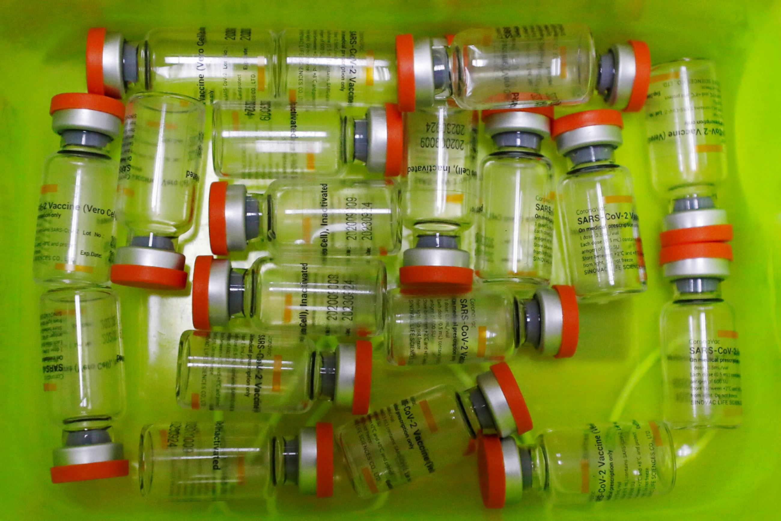 Empty Sinovac vaccine vials in a bright green tray are seen at a hospital during mass COVID-19, vaccination in Jakarta, Indonesia on January 21, 2021. 