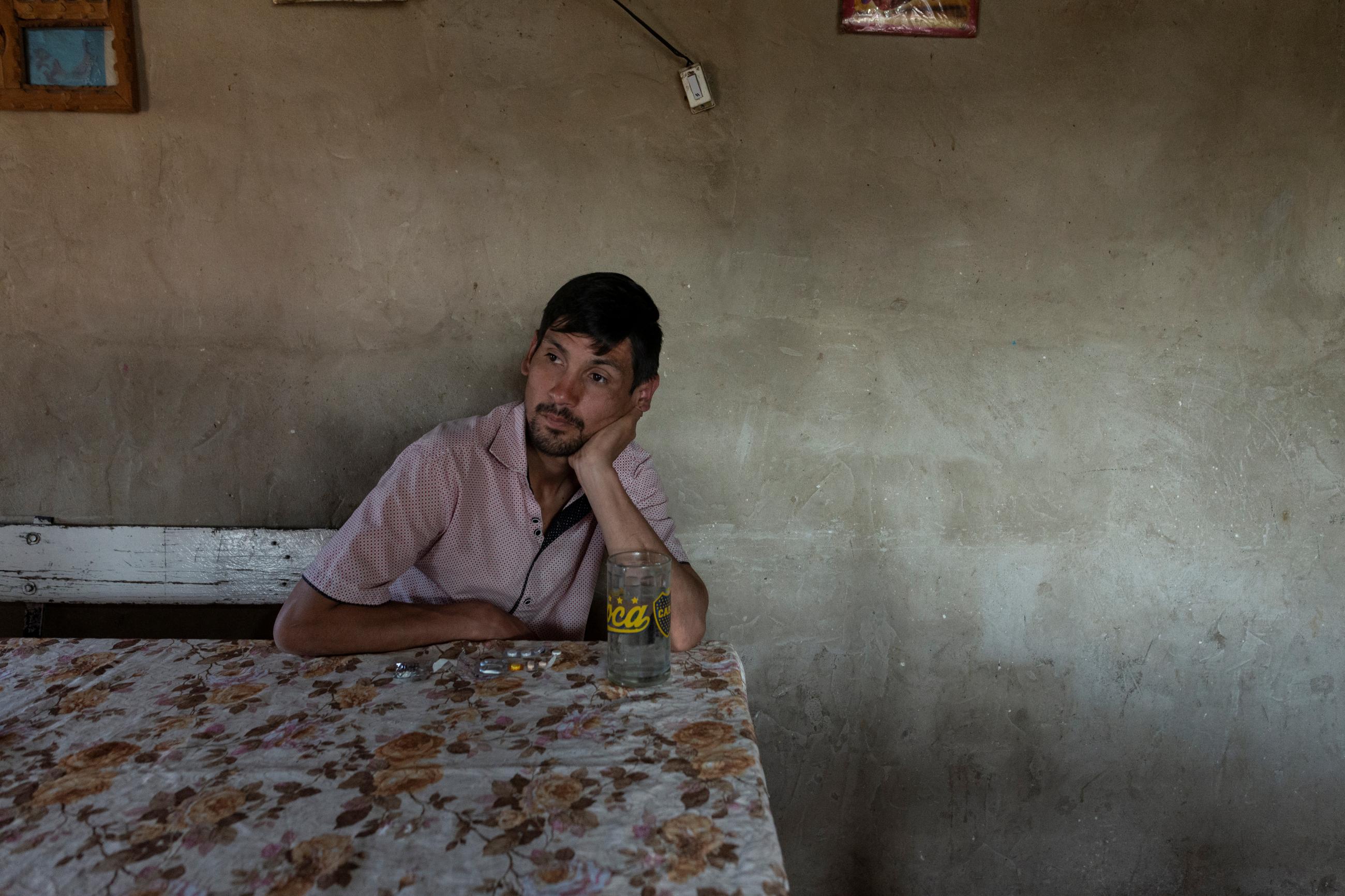 Cristian Molina, 26, takes his tuberculosis medication at his house in the shantytown of Lujan in Buenos Aires, Argentina, September 26, 2019. Molina is prescribed to take 11 tablets per day, seven in the morning and four in the afternoon, which often give him a stomachache. 