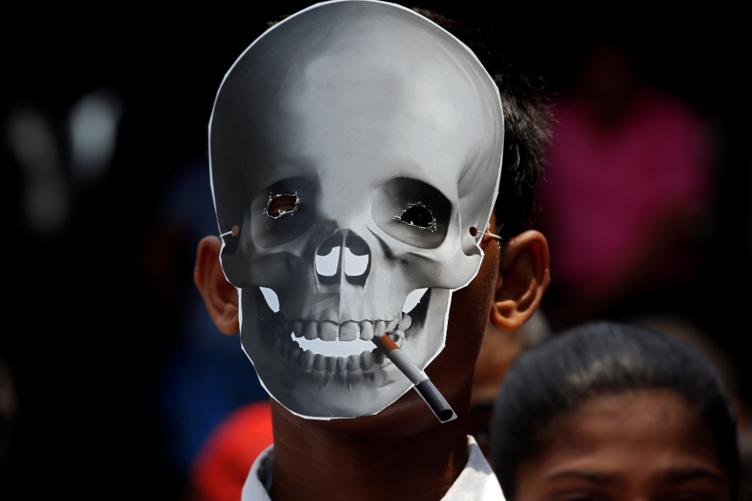 A child wears a skull mask at an anti-tobacco awareness rally on World No Tobacco Day in Kolkata, India, on May 31, 2019. REUTERS/Rupak De Chowdhuri