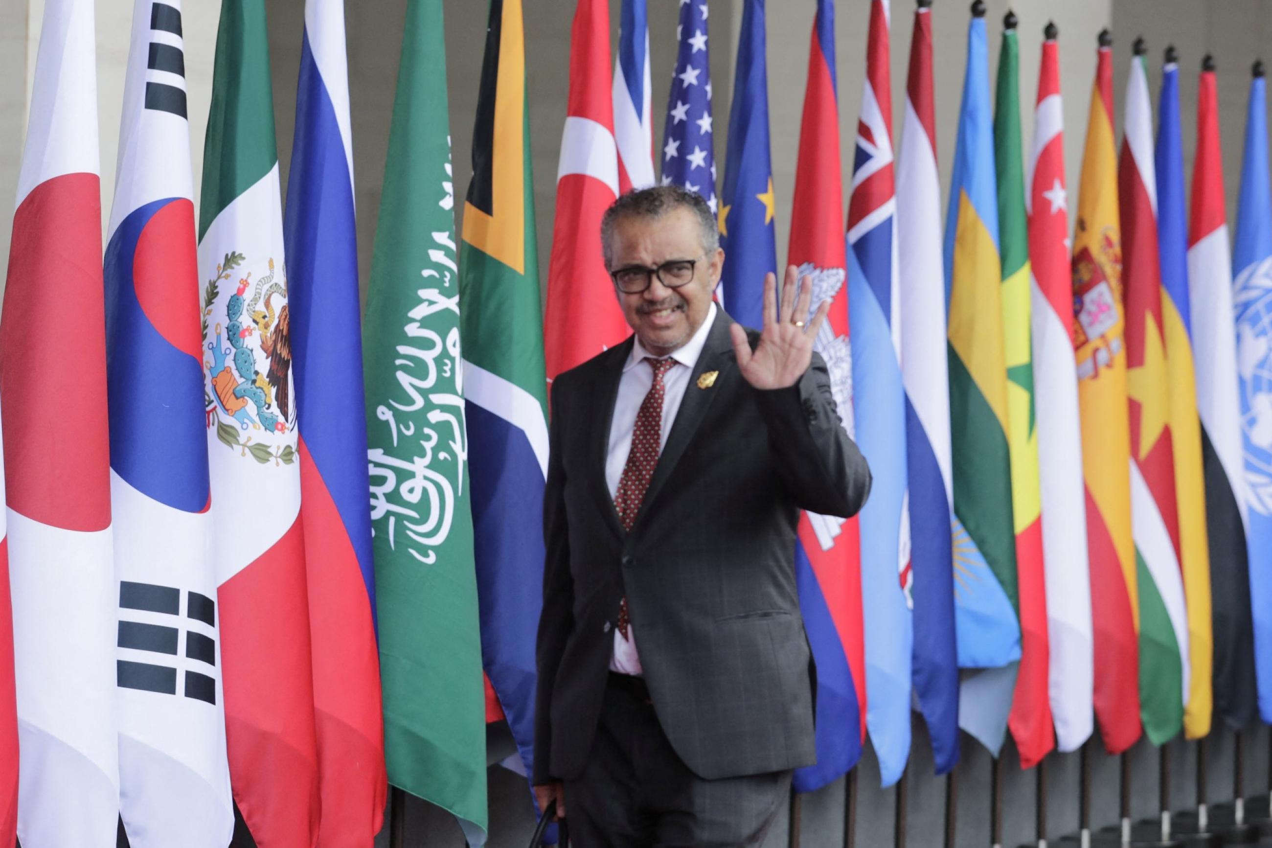 WHO Director-general Tedros waves