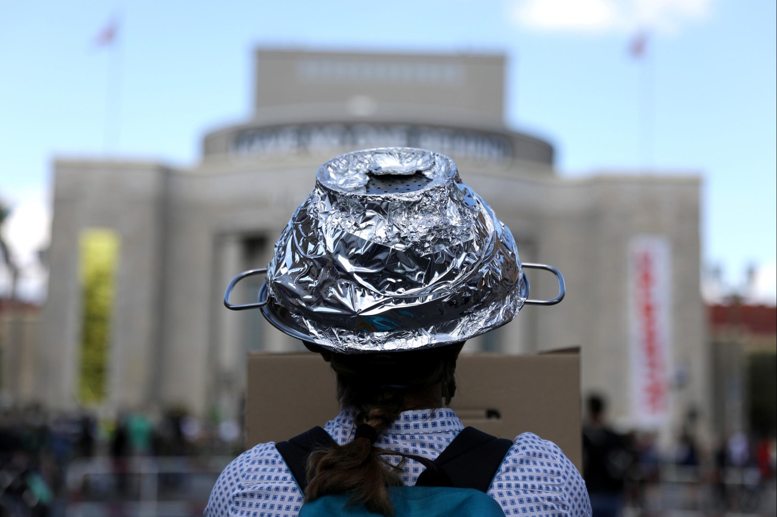 A woman attends a protest of conspiracy theorists and other demonstrators at Rosa Luxemburg Platz, amid the spread of COVID-19, in Berlin, Germany, on May 9, 2020.