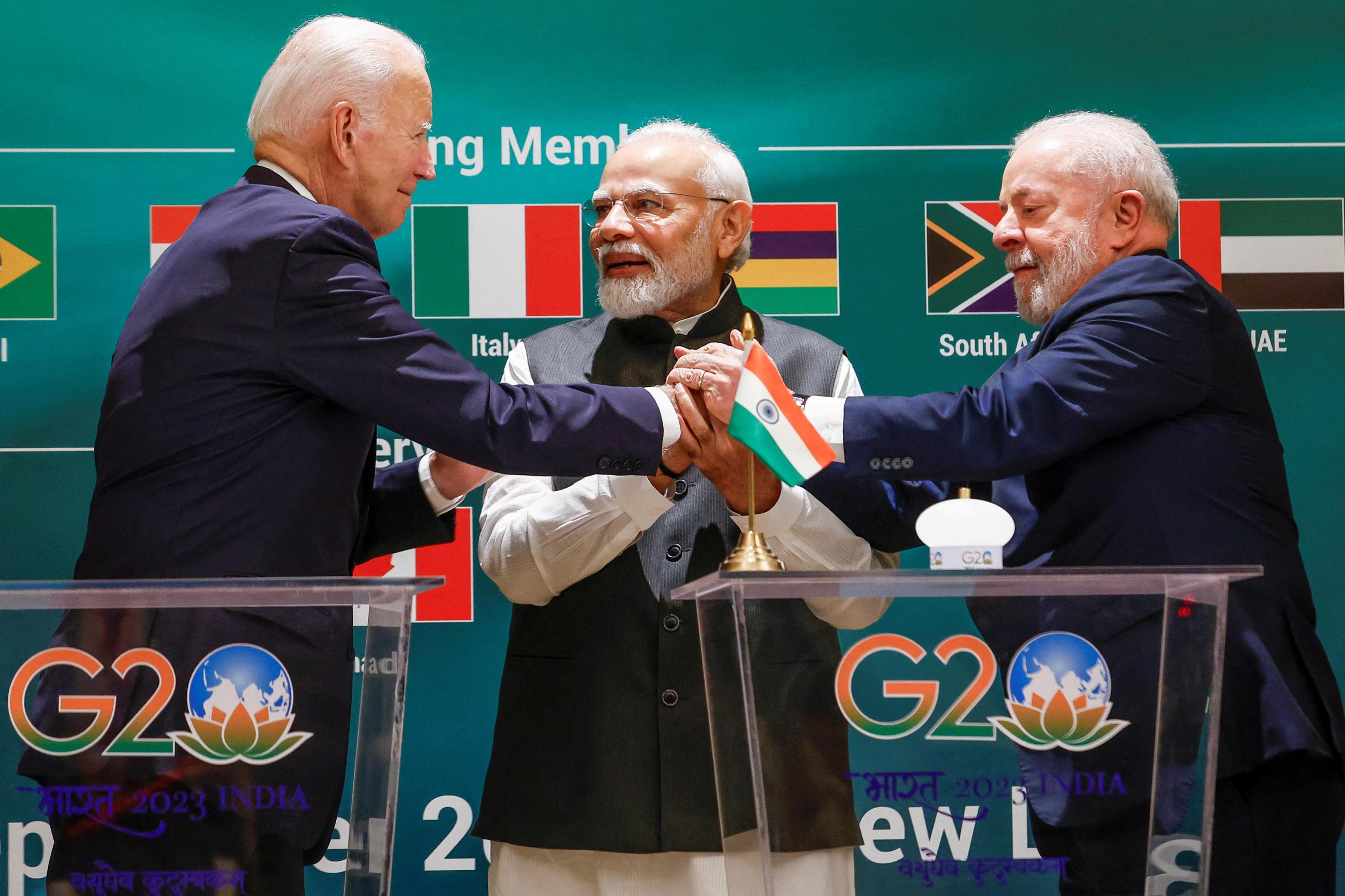 U.S. President Joe Biden, Indian Prime Minister Narendra Modi and Brazilian President Luiz Inacio Lula da Silva hold hands as they attend the launch of the Global Biofuels Alliance at the G20 summit in New Delhi, India, September 9, 2023. 