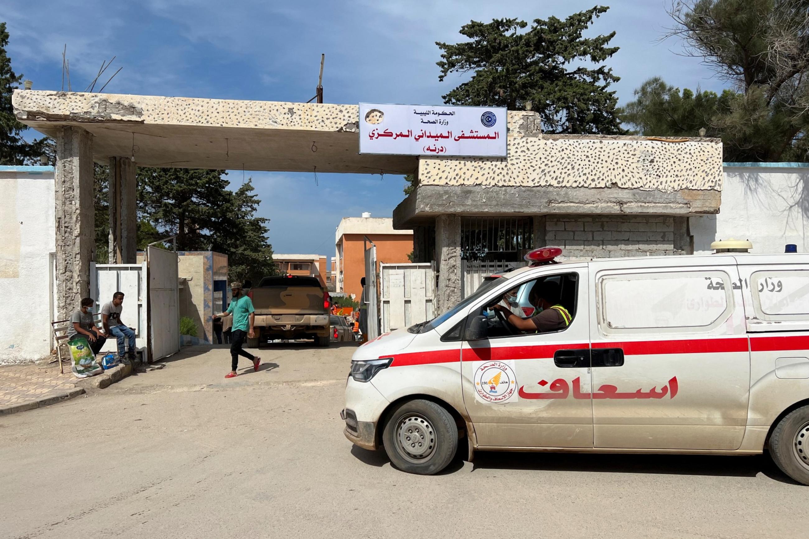 An ambulance arrives outside a hospital following deadly floods, in Derna, Libya, on September 17, 2023.