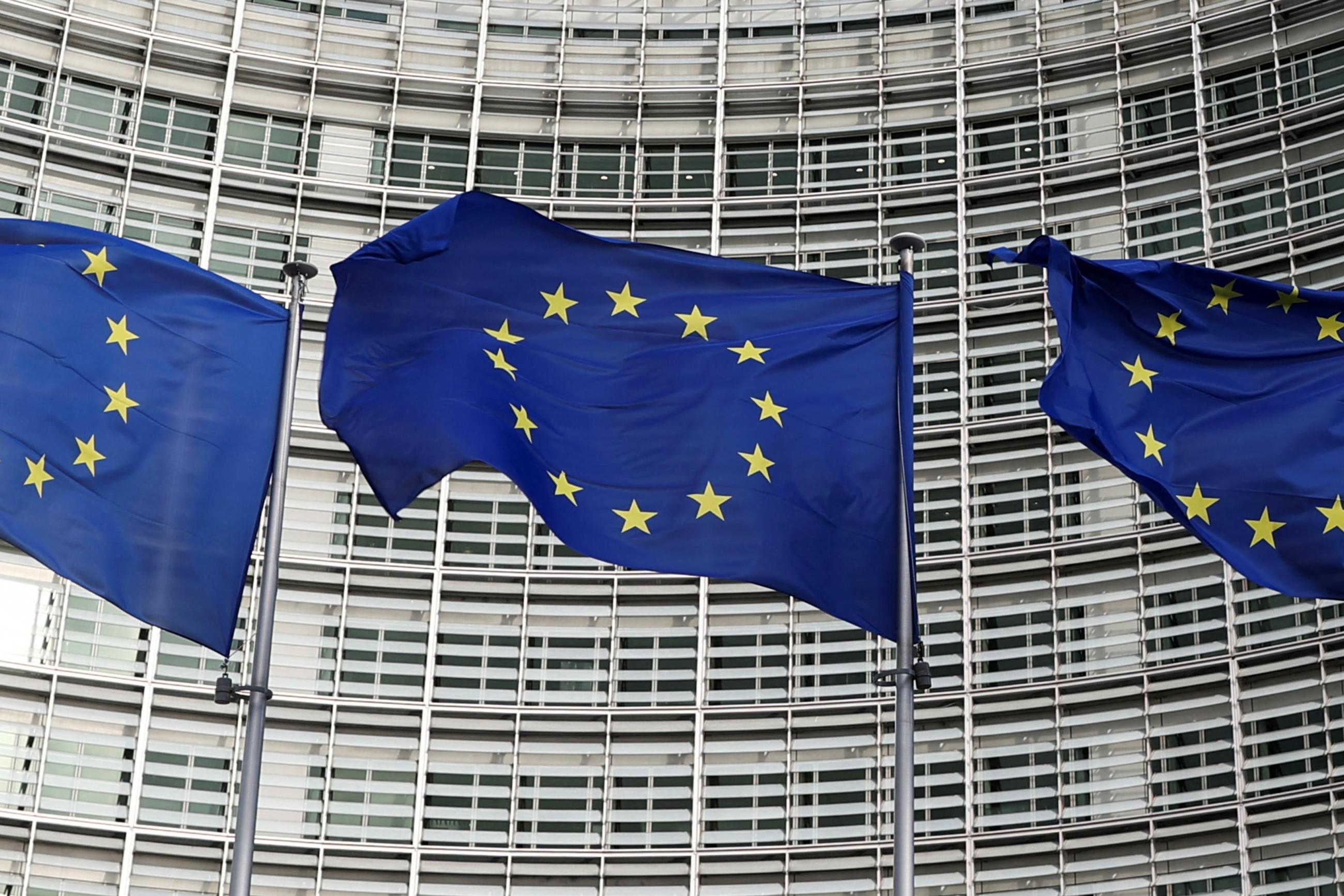 European Union flags fly outside the European Commission in Brussels.