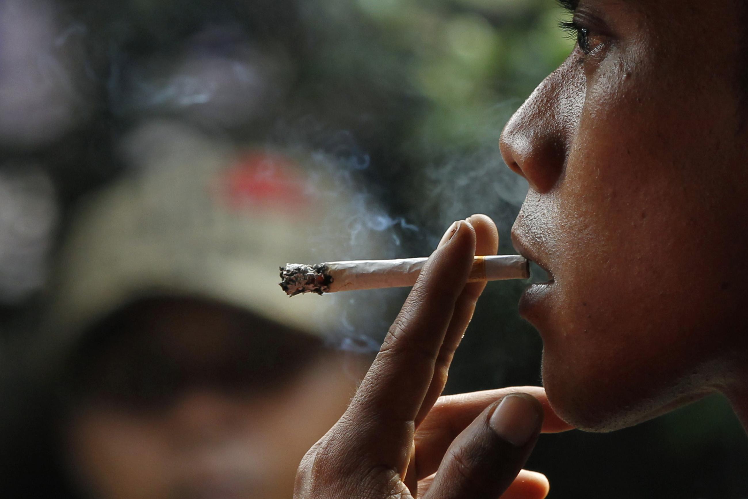 A man smokes a cigarette.