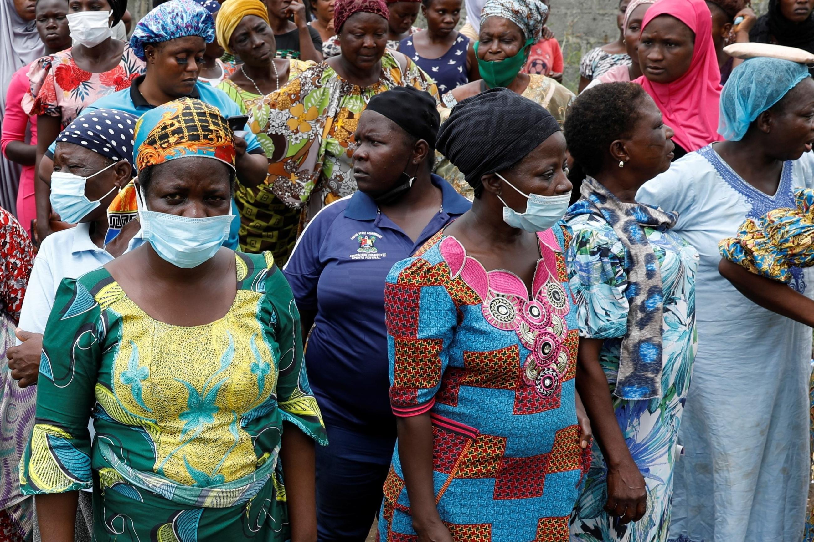 Women queue for food parcels during distribution by volunteers of the Lagos food bank initiative.