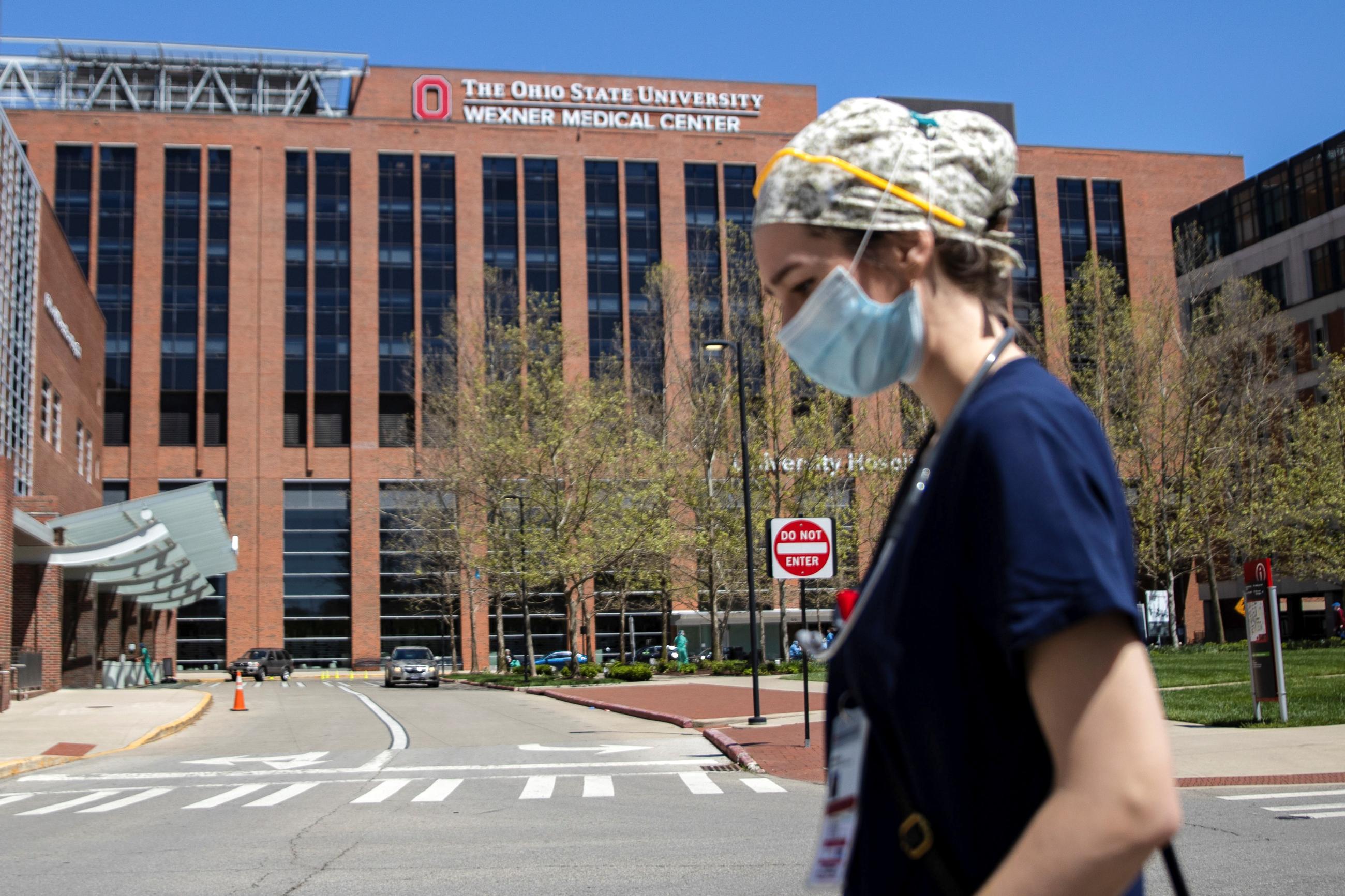 A nurse goes to her hospital shift after graduating from the nursing school.