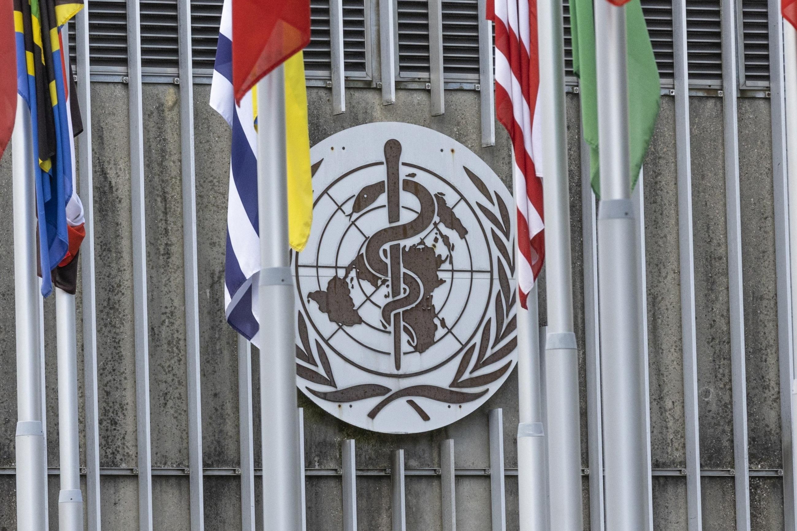 The World Health Organization (WHO) logo is seen near its headquarters.