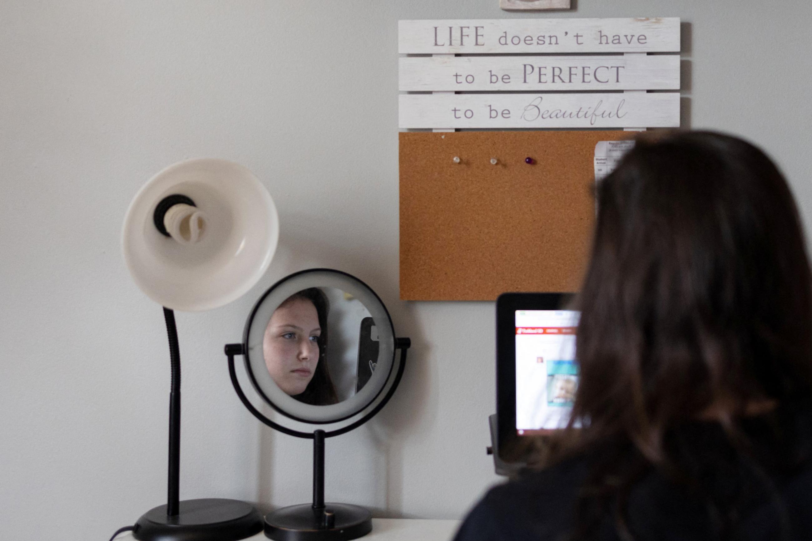 Sara Lundberg, who struggled with anxiety and depression during the COVID pandemic, is seen in her bedroom.